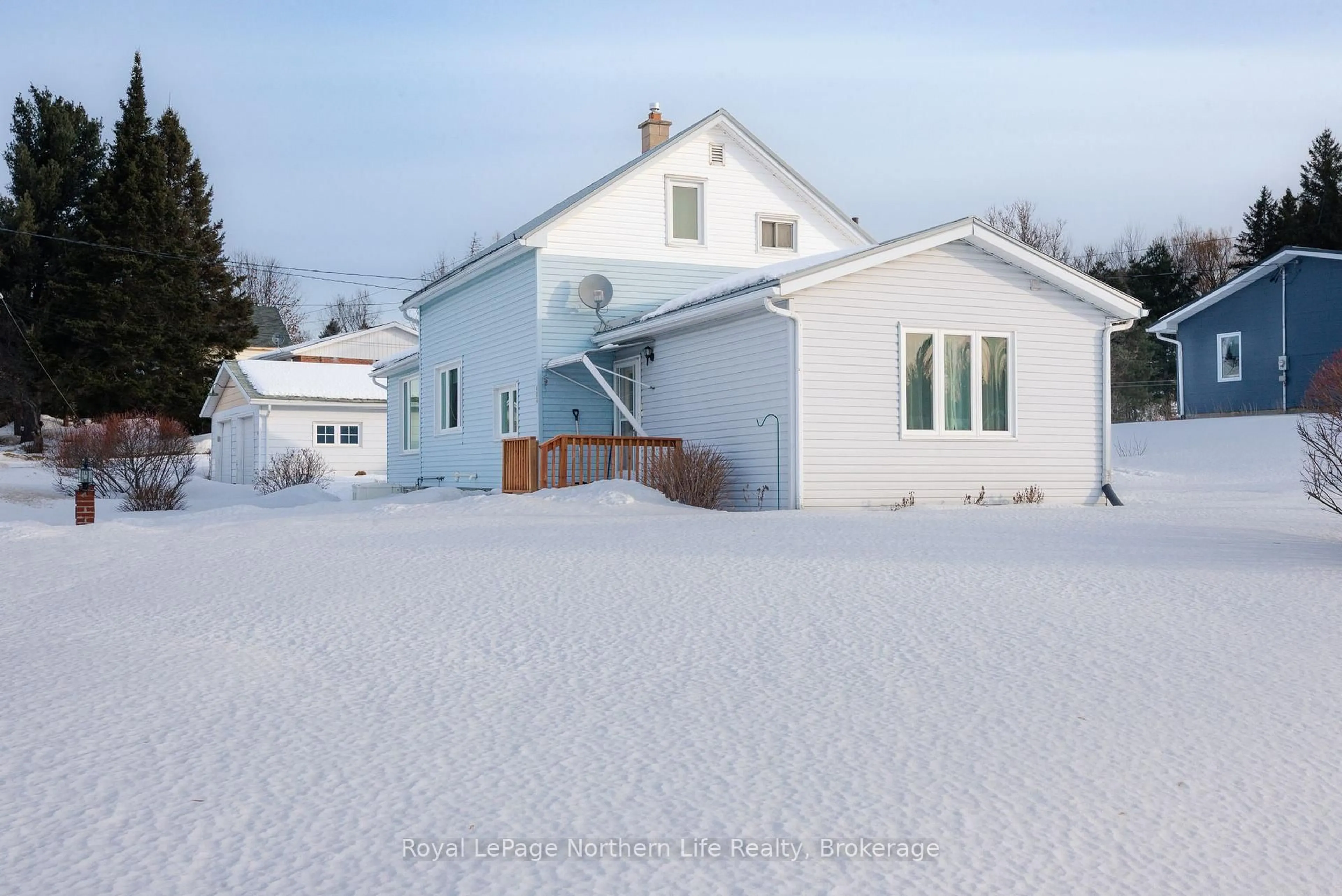 A pic from outside/outdoor area/front of a property/back of a property/a pic from drone, street for 404 Main St, Powassan Ontario P0H 1Z0