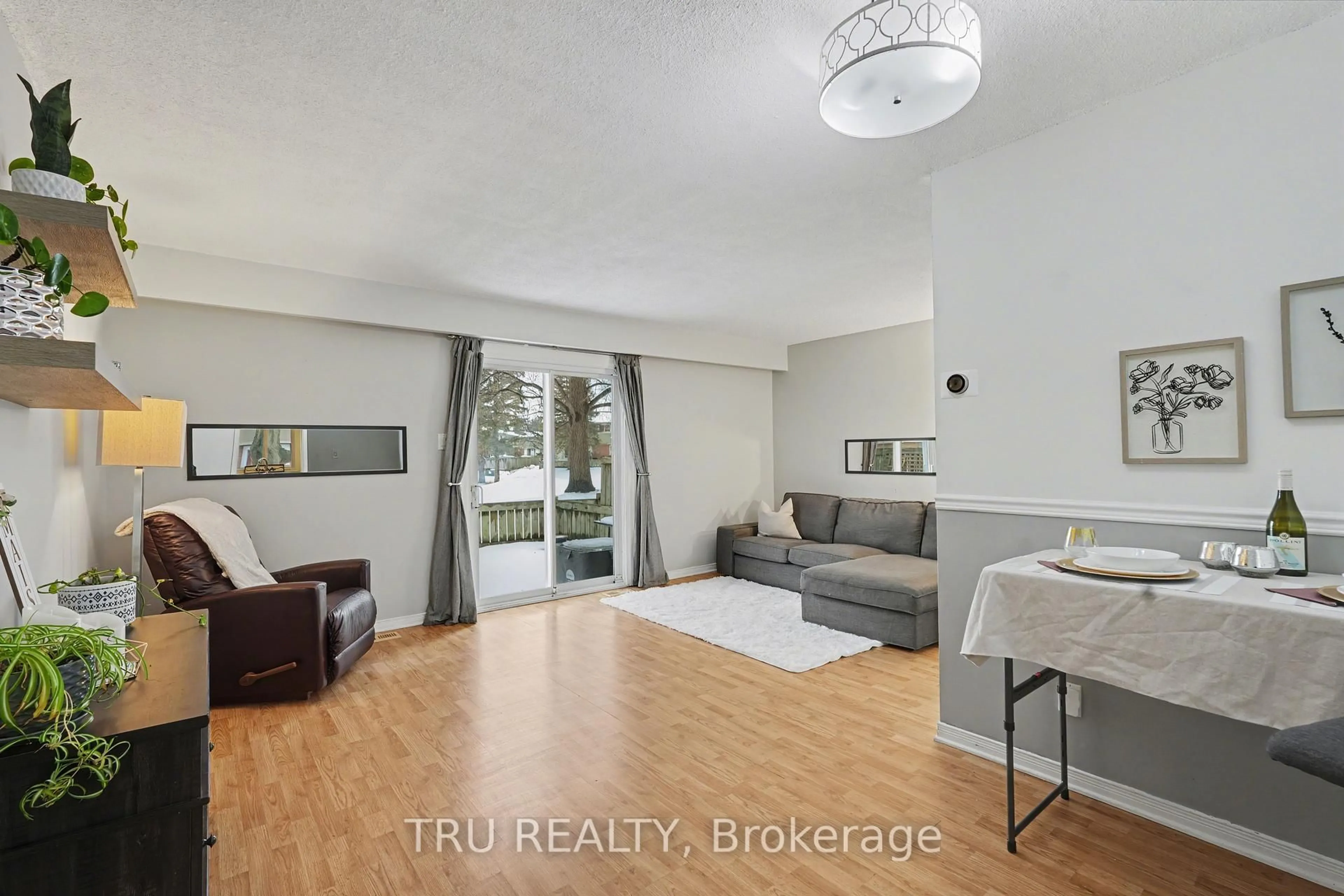 Living room with furniture, wood/laminate floor for 463F Moodie Dr, Ottawa Ontario K2H 8T7