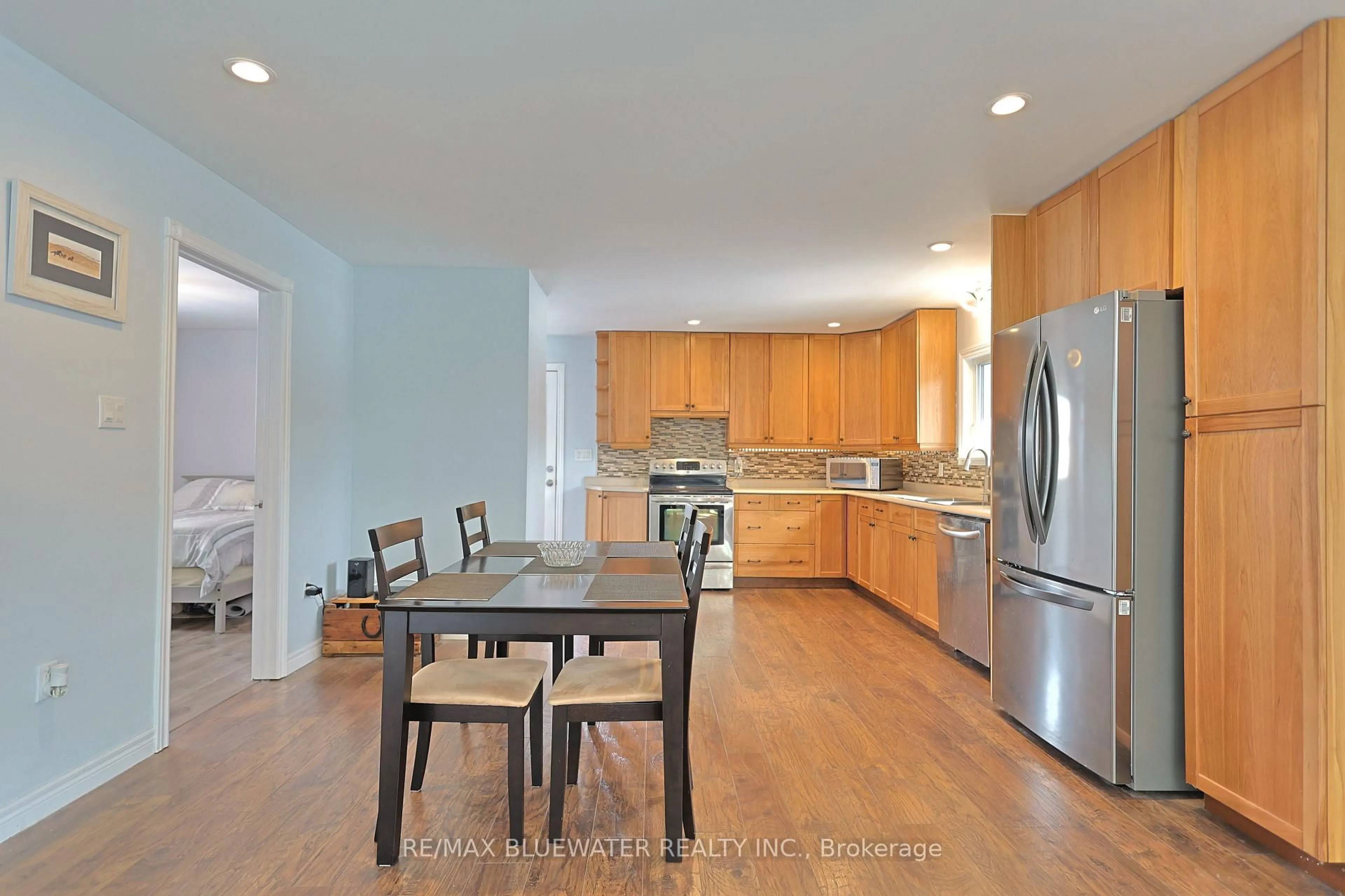 Open concept kitchen, wood/laminate floor for 8296 Burwell Rd, Lambton Shores Ontario N0M 1T0