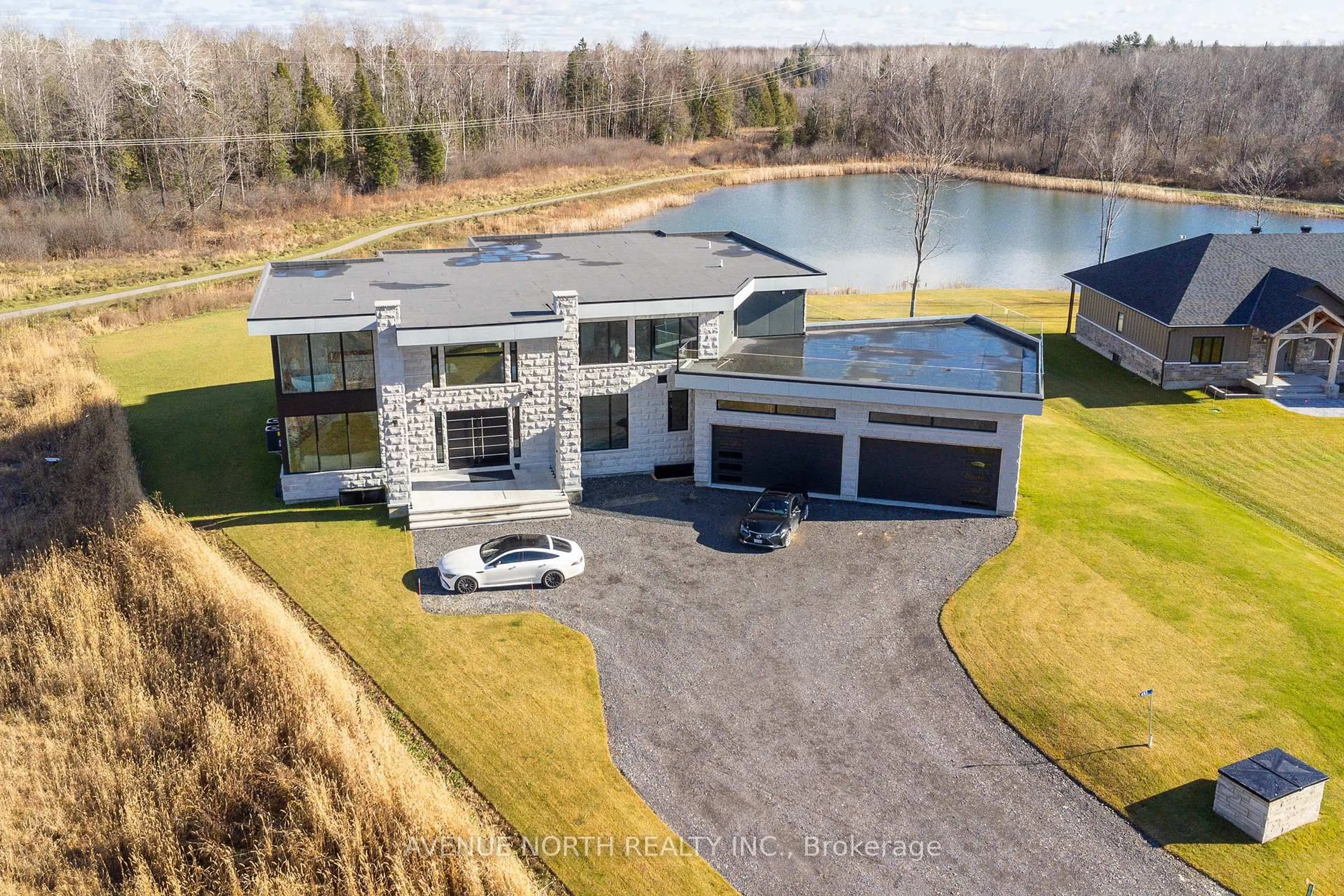 A pic from outside/outdoor area/front of a property/back of a property/a pic from drone, water/lake/river/ocean view for 493 Shoreway Dr, Greely Ontario K4P 0G3