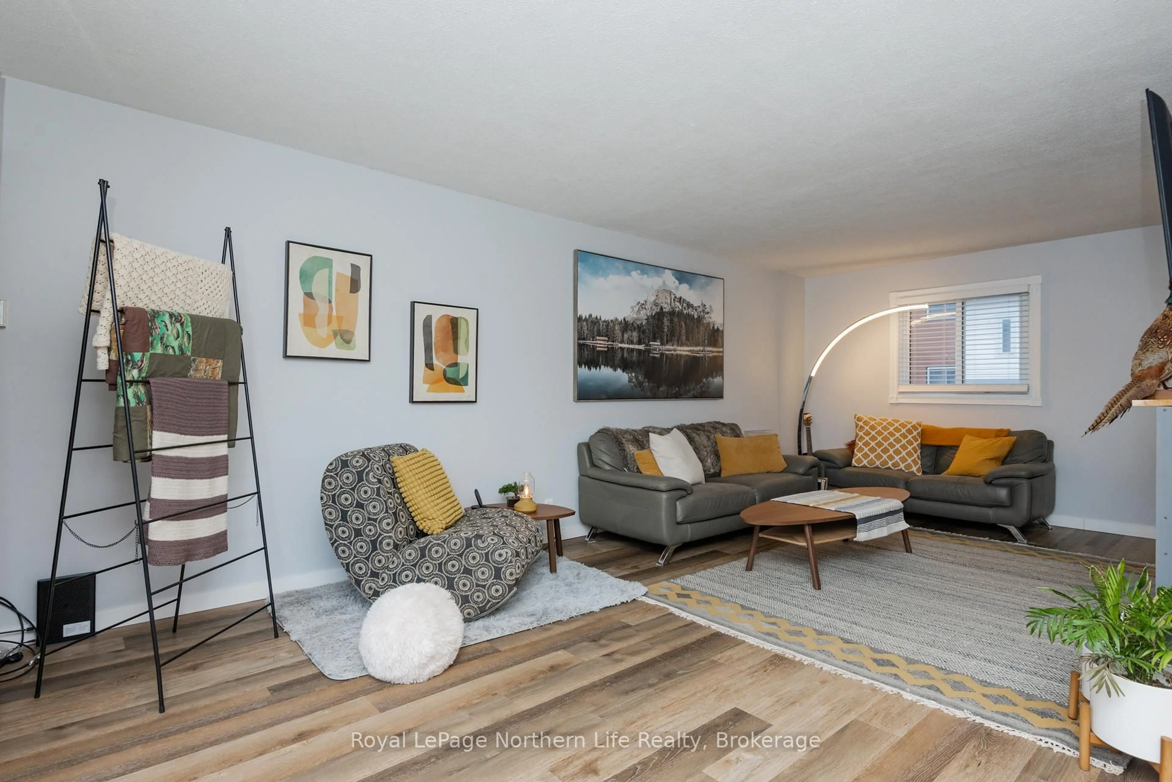 Living room with furniture, wood/laminate floor for 850 Lakeshore Dr #19, North Bay Ontario P1A 2G8