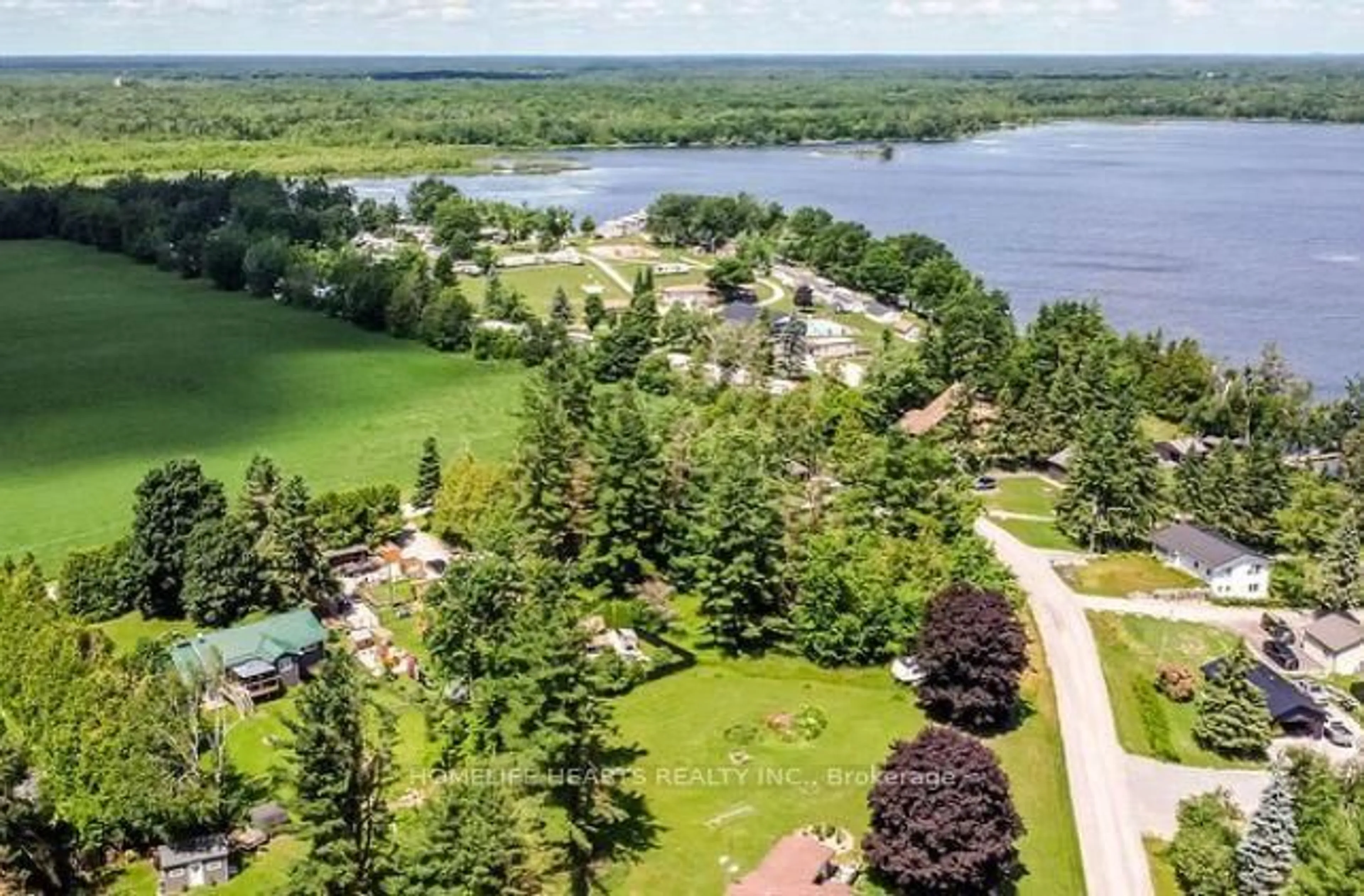 A pic from outside/outdoor area/front of a property/back of a property/a pic from drone, water/lake/river/ocean view for 122 Day Dr, Kawartha Lakes Ontario L3V 6H5