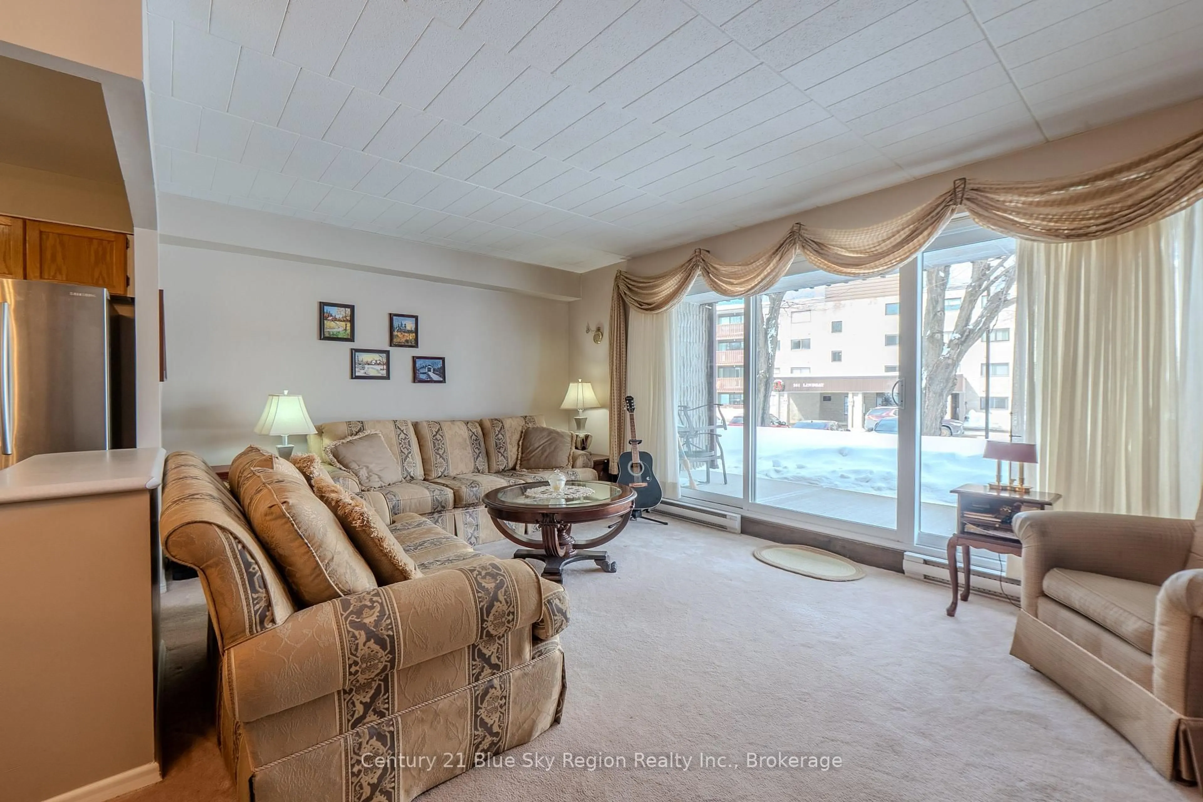 Living room with furniture, carpet floor for 149 Lindsay St #104, North Bay Ontario P1B 7Z1