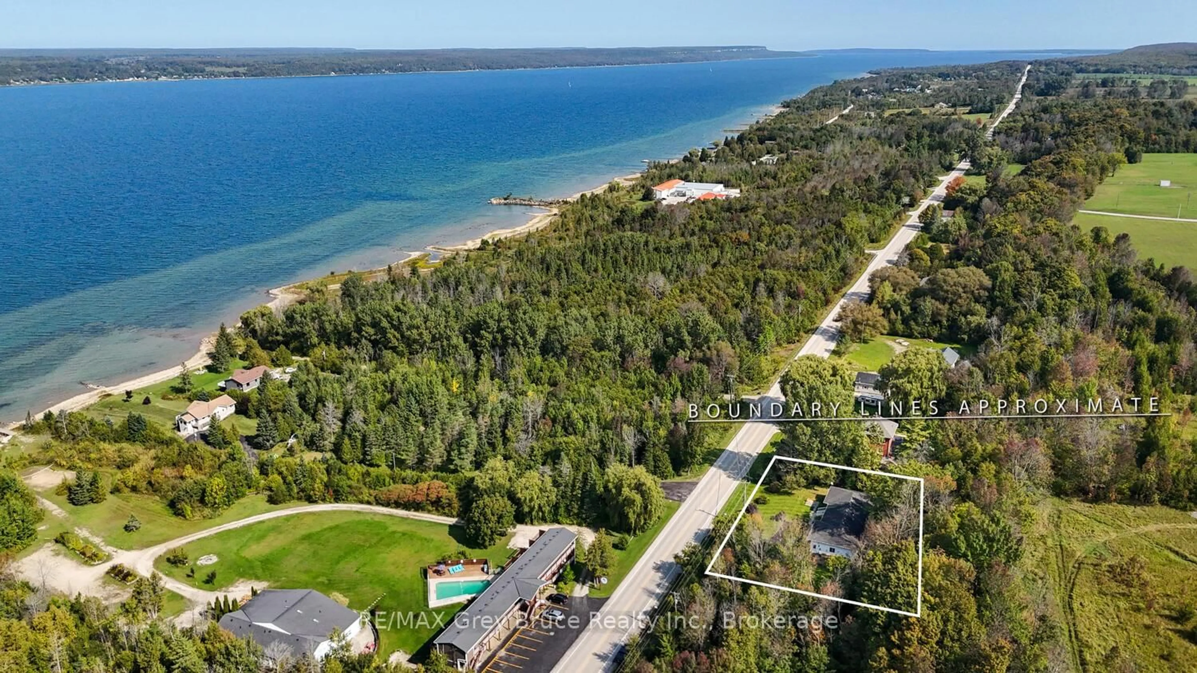 A pic from outside/outdoor area/front of a property/back of a property/a pic from drone, water/lake/river/ocean view for 501204 Grey 1 Rd, Georgian Bluffs Ontario N0H 2T0