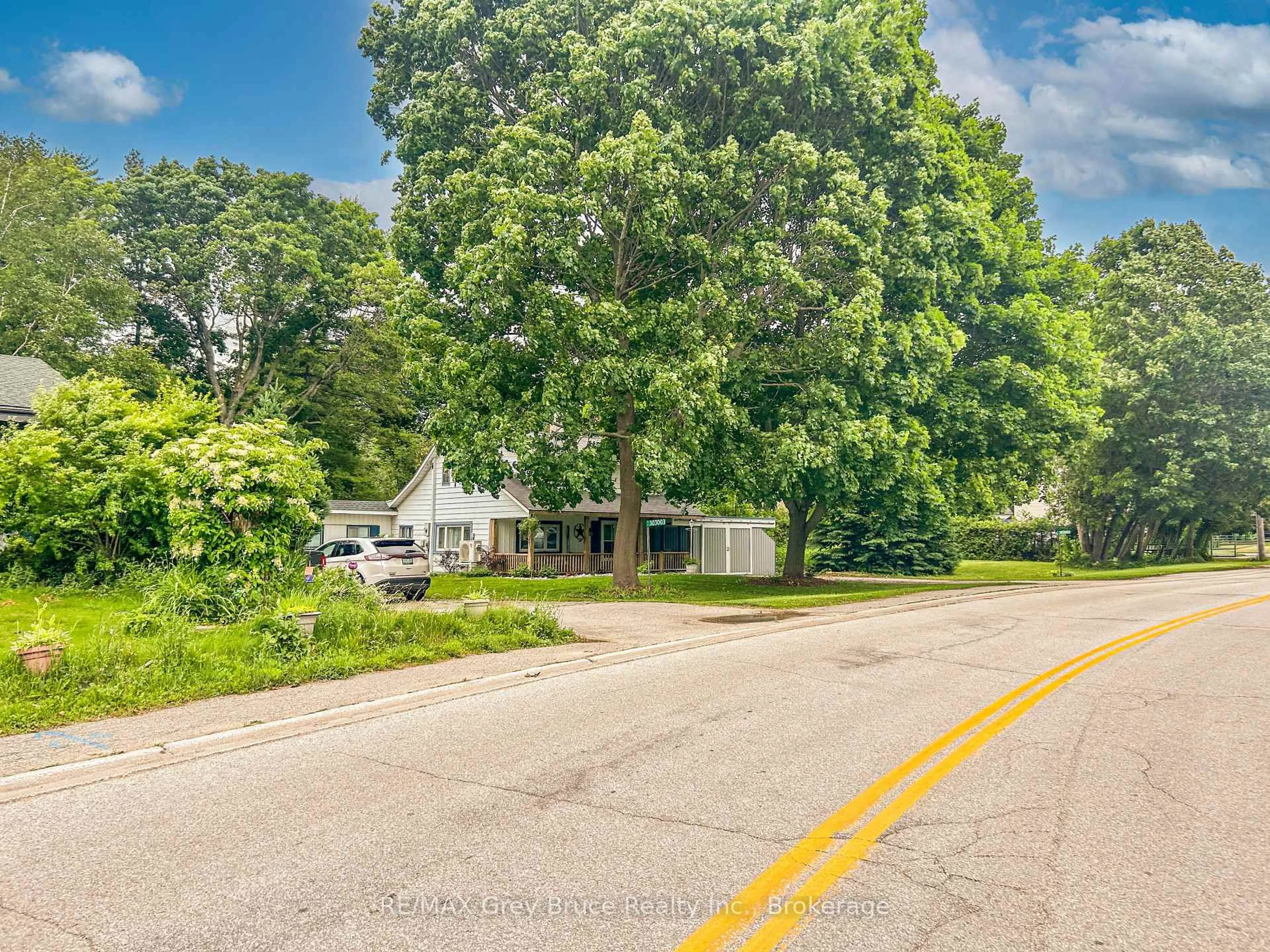 A pic from outside/outdoor area/front of a property/back of a property/a pic from drone, street for 303005 Grey  15 Rd, Meaford Ontario N0H 1V0