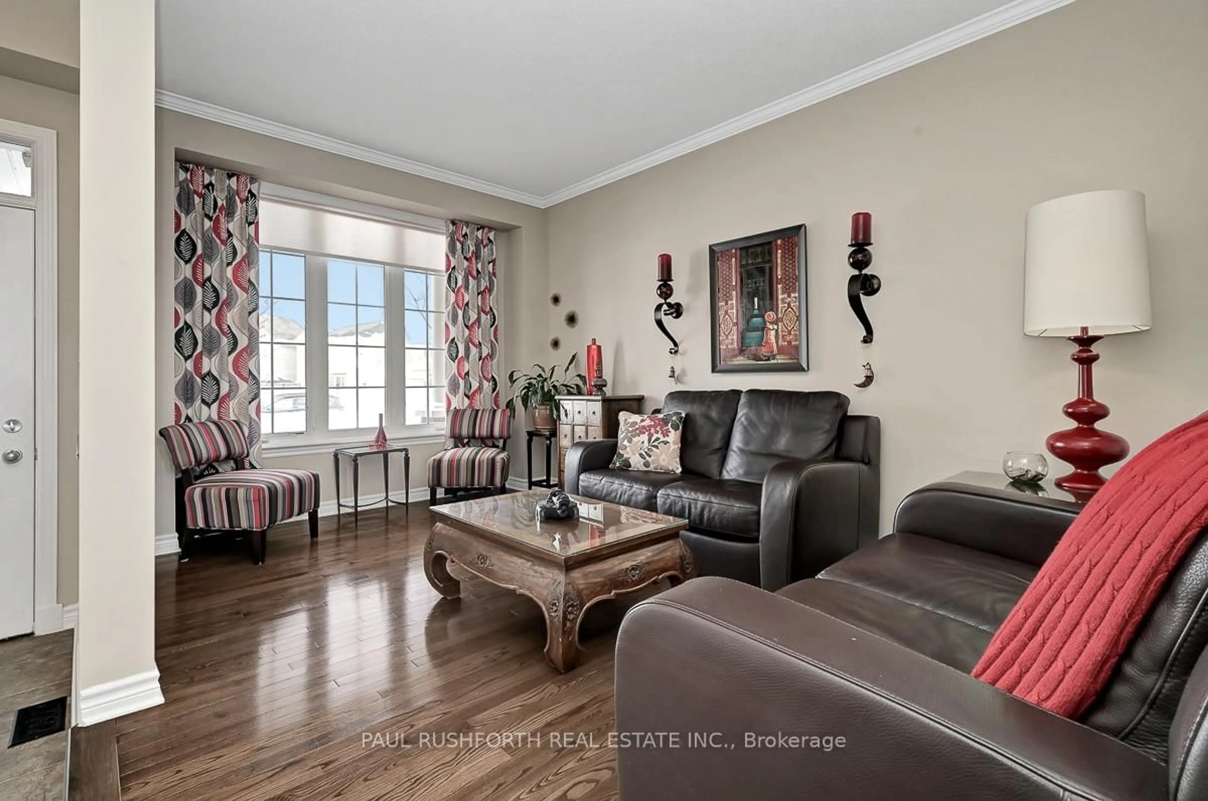 Living room with furniture, wood/laminate floor for 639 Pine Vista Dr, Orleans Ontario K4A 5B4