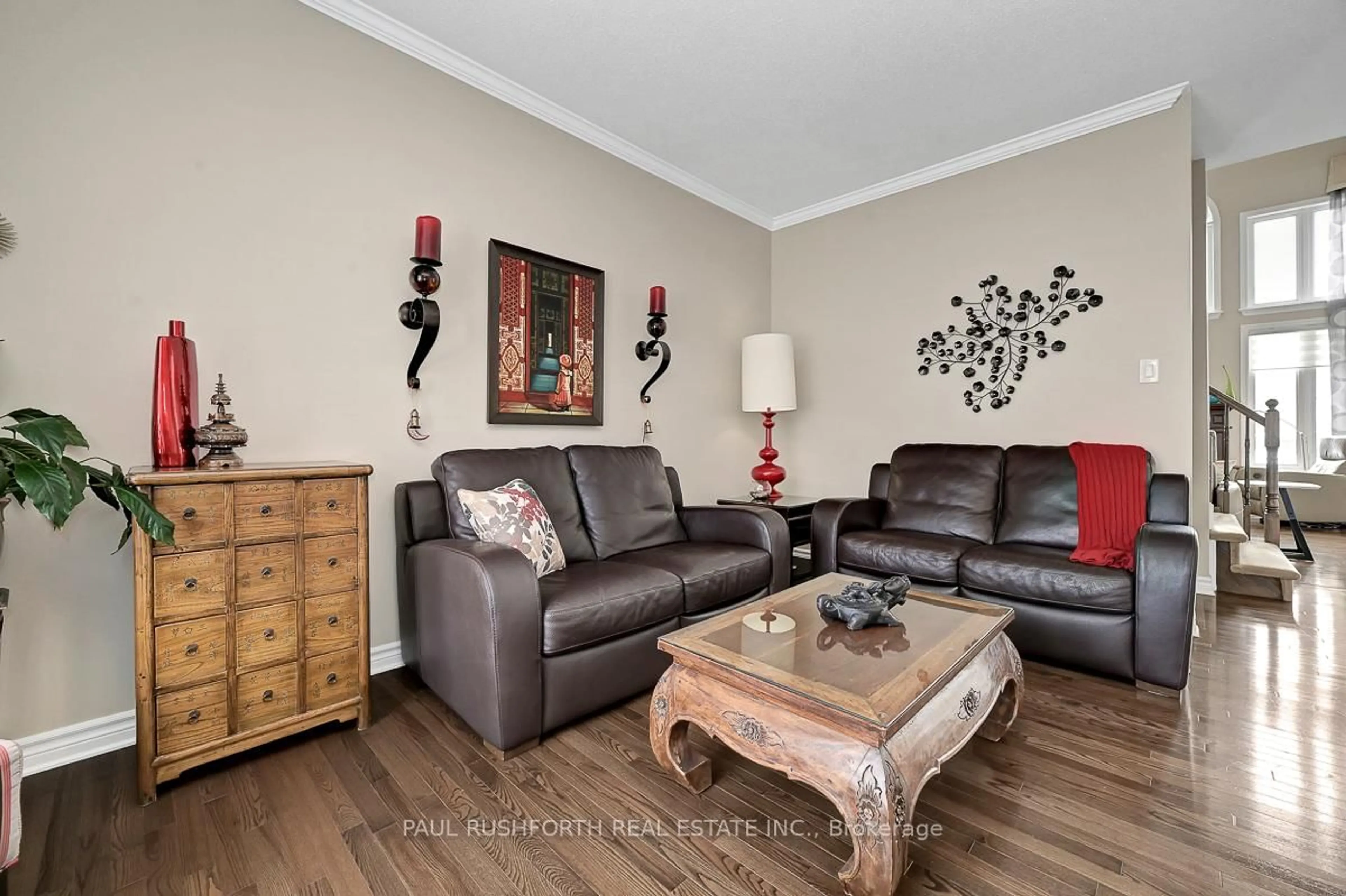 Living room with furniture, wood/laminate floor for 639 Pine Vista Dr, Orleans Ontario K4A 5B4