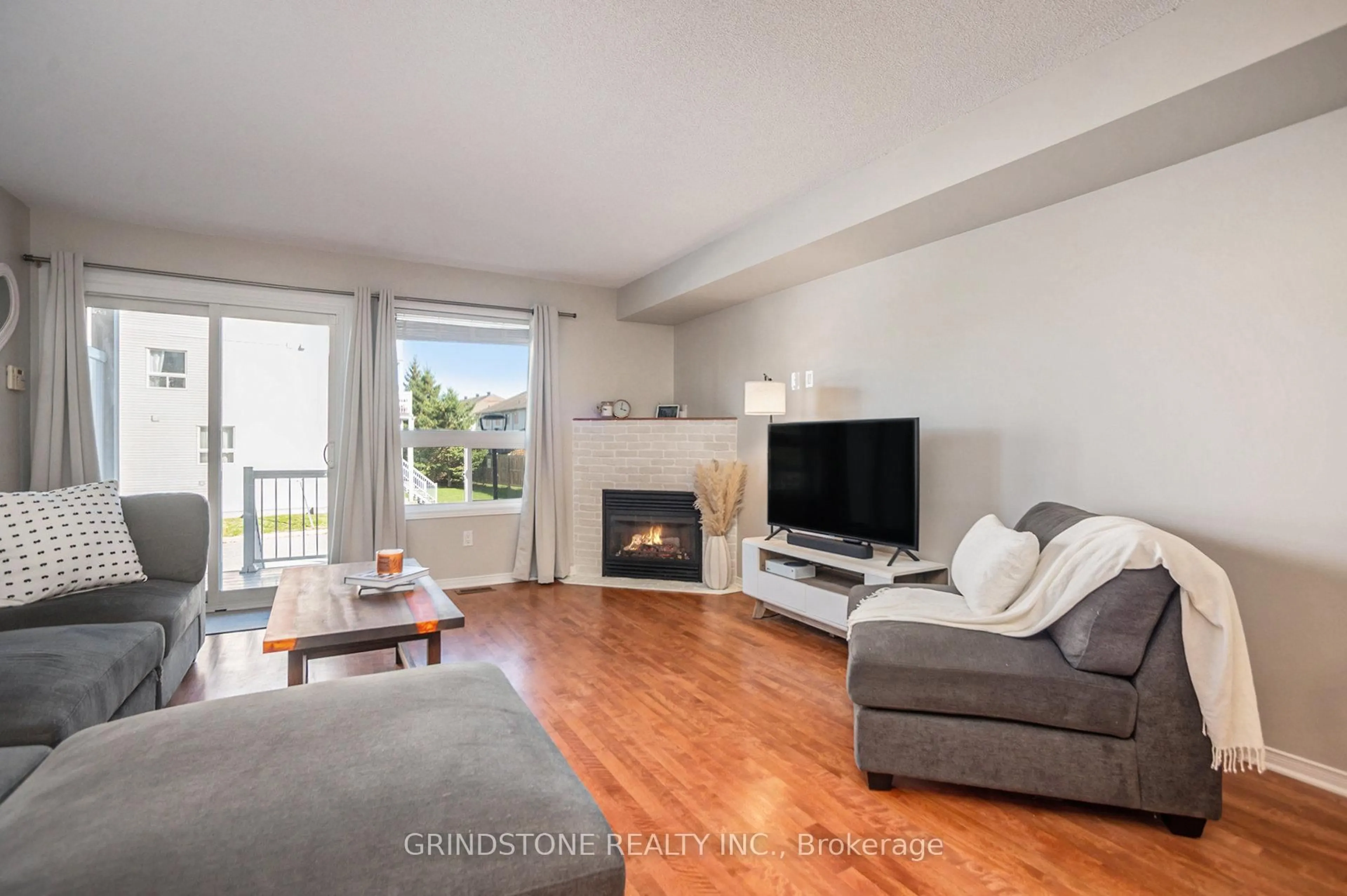 Living room with furniture, wood/laminate floor for 904 Longfields Dr, Ottawa Ontario K2J 5K6