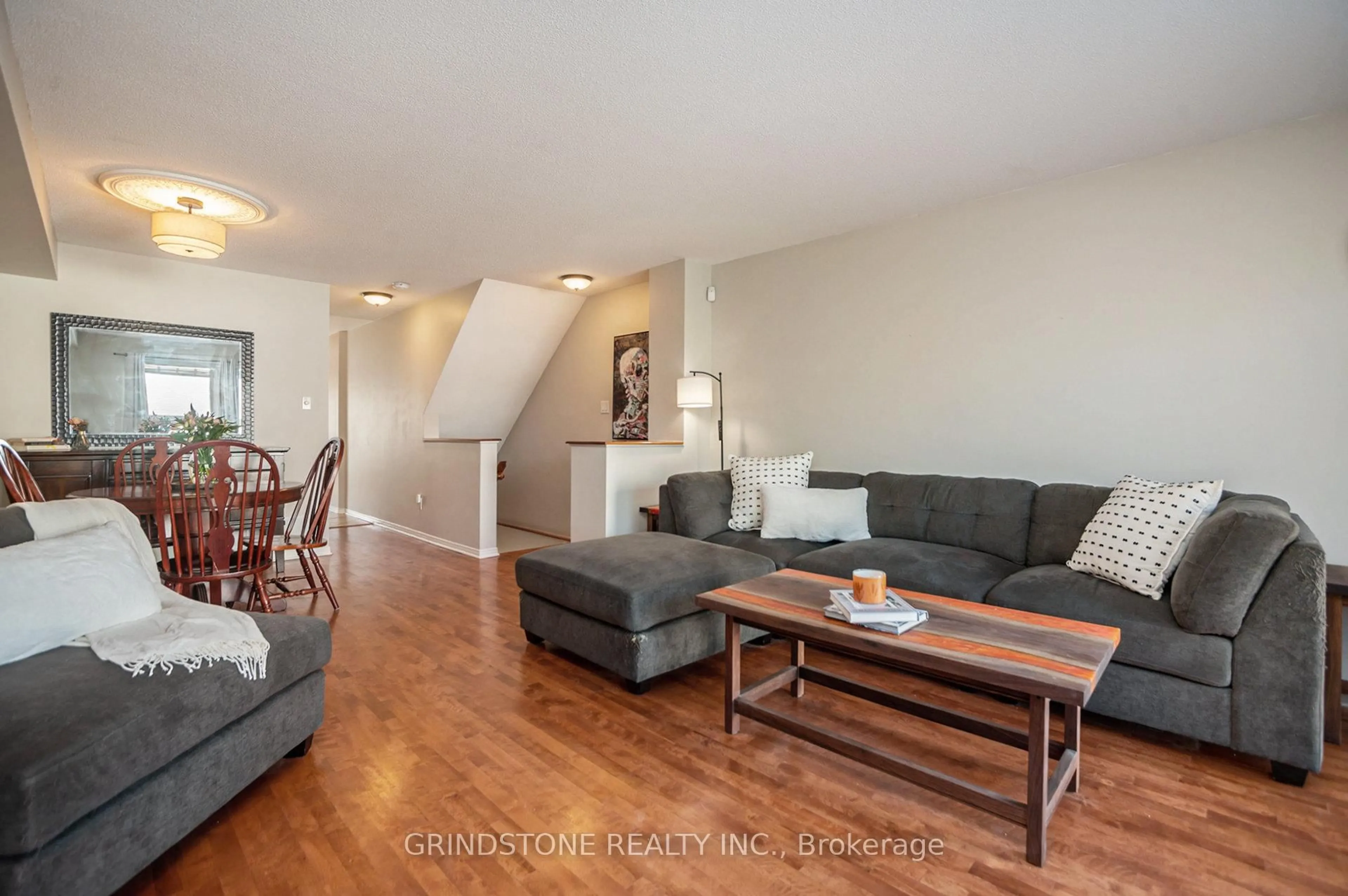 Living room with furniture, wood/laminate floor for 904 Longfields Dr, Ottawa Ontario K2J 5K6