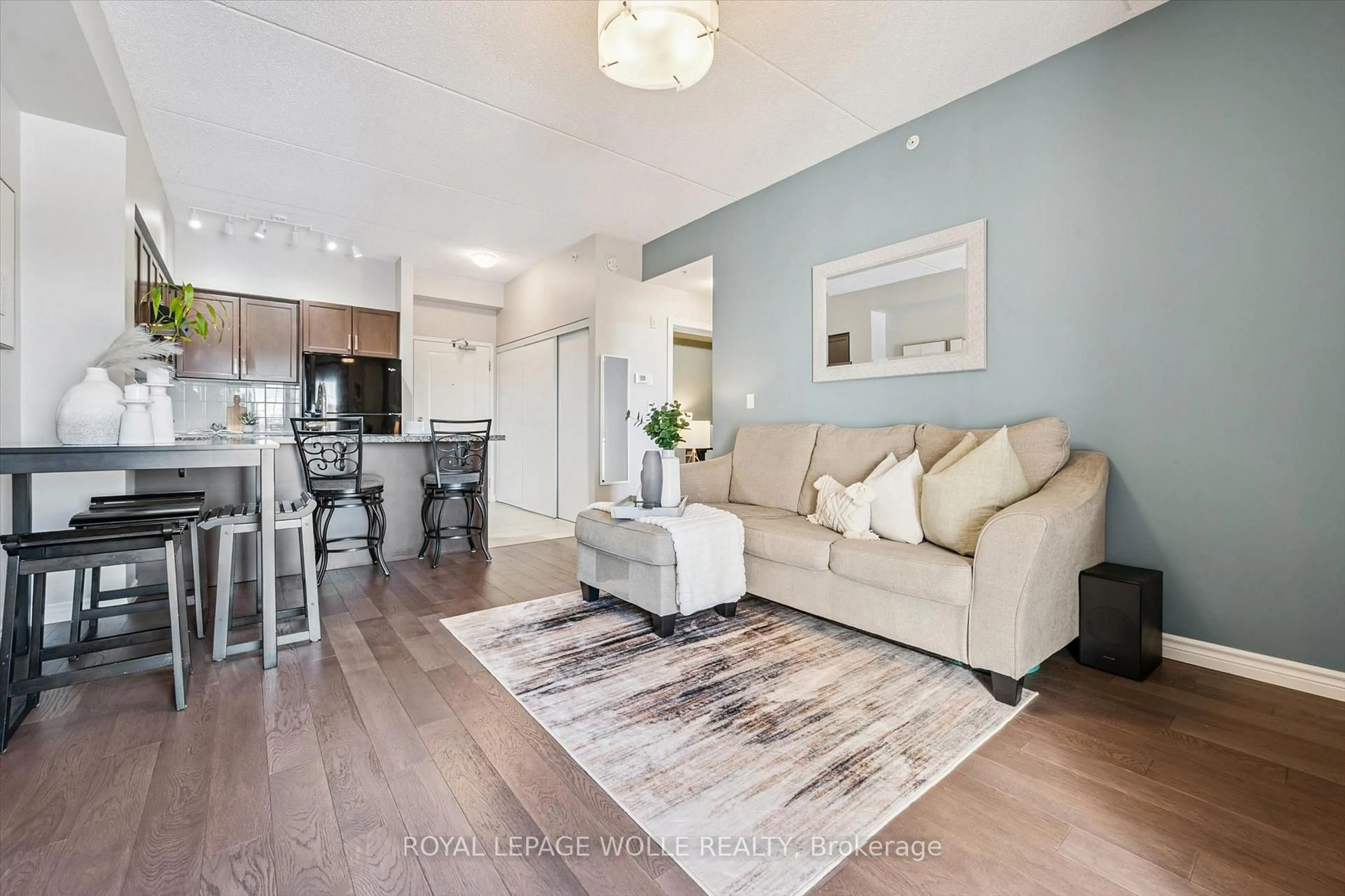 Living room with furniture, wood/laminate floor for 1077 Gordon St #333, Guelph Ontario N1G 0E3