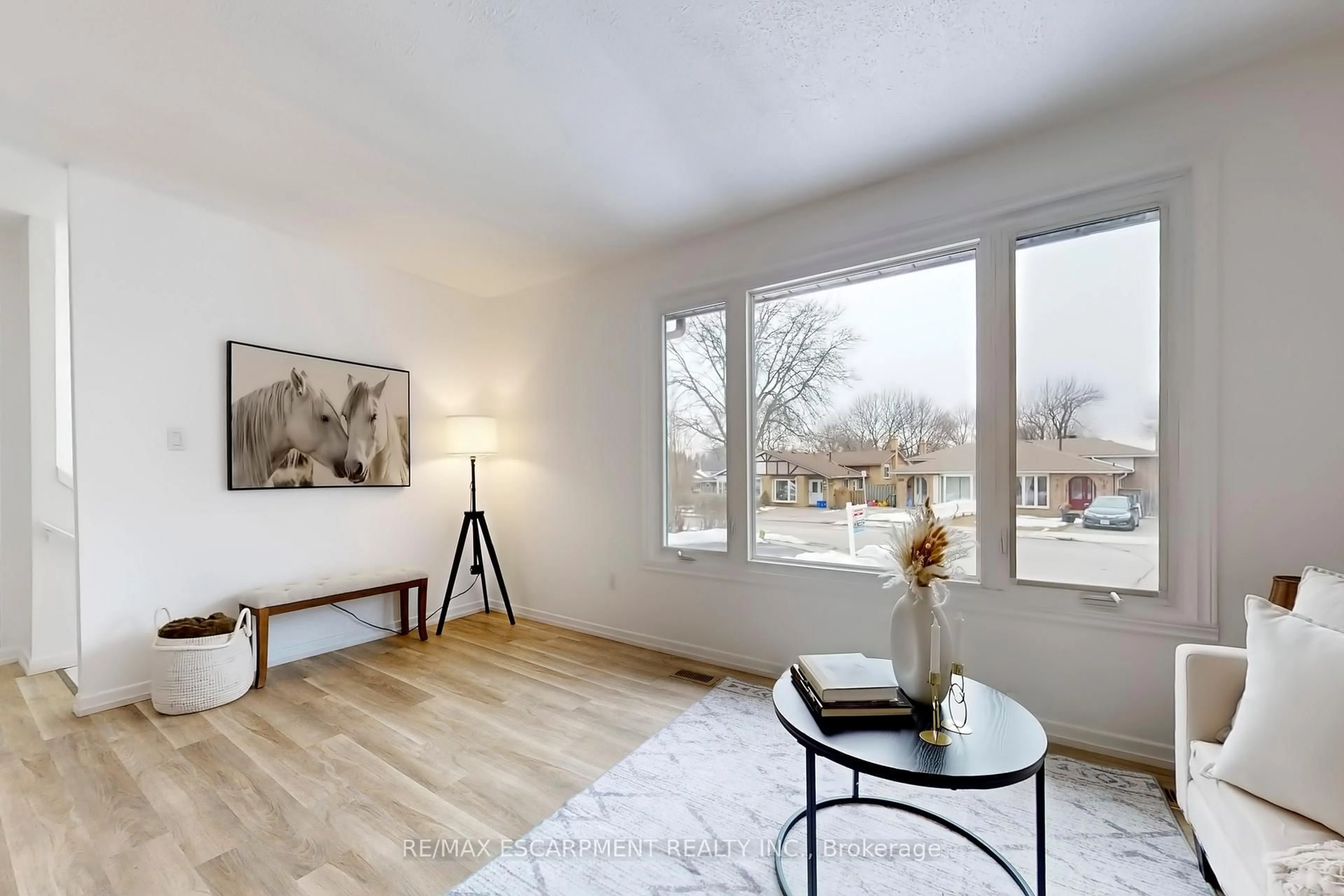 Living room with furniture, wood/laminate floor for 380 Magnolia Dr, Hamilton Ontario L9C 6N7
