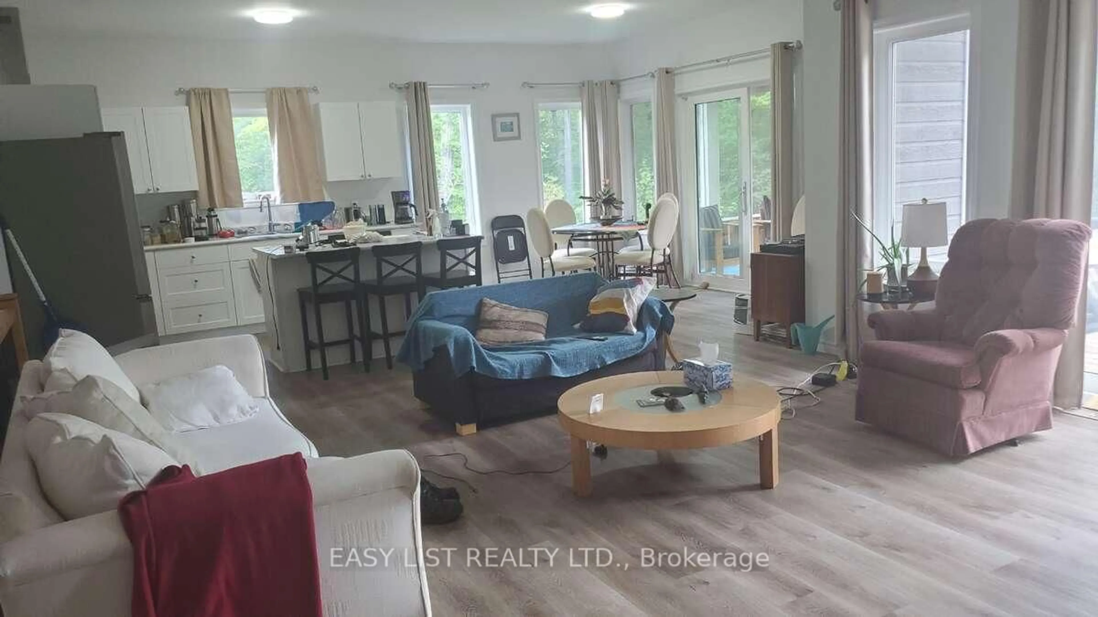 Living room with furniture, wood/laminate floor for 803 Barrett Chute Rd, Calabogie Ontario K0J 1H0