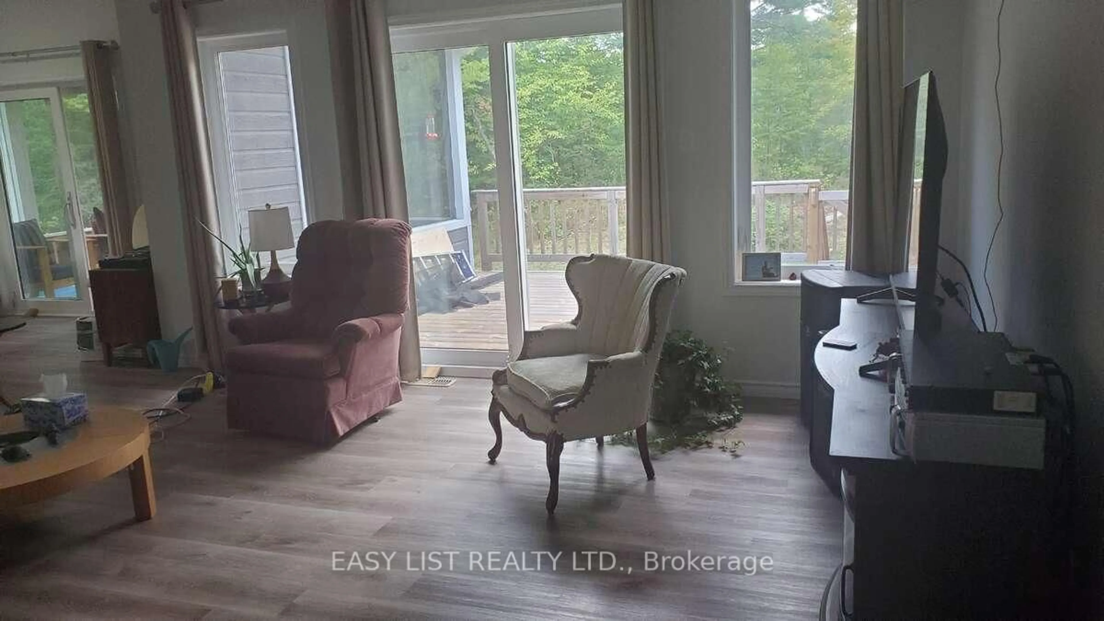 Living room with furniture, wood/laminate floor for 803 Barrett Chute Rd, Calabogie Ontario K0J 1H0
