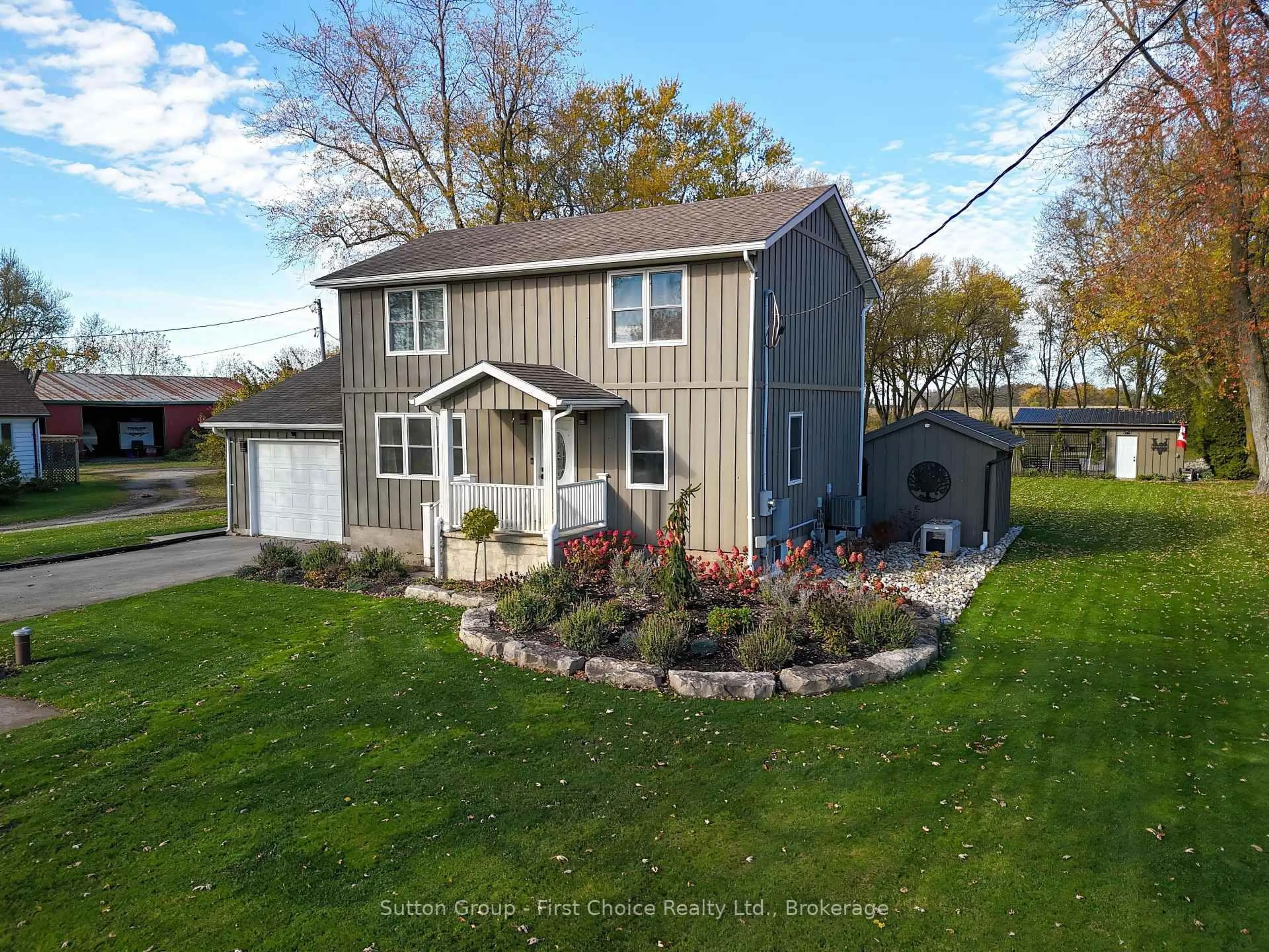 A pic from outside/outdoor area/front of a property/back of a property/a pic from drone, unknown for 3502 Highway 7, Perth South Ontario N5A 6S3