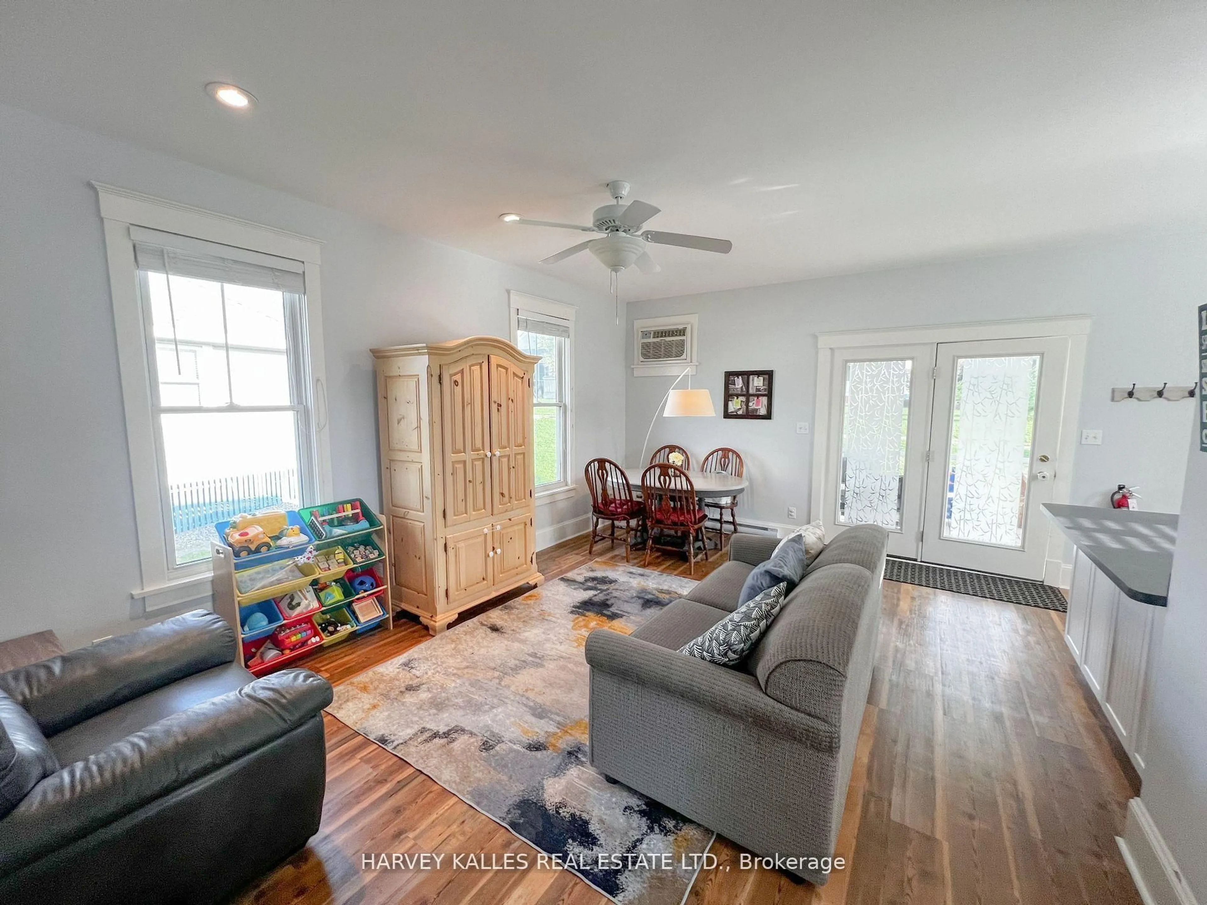 Living room with furniture, wood/laminate floor for 24 Butternut Lane, Prince Edward County Ontario K0K 1P0