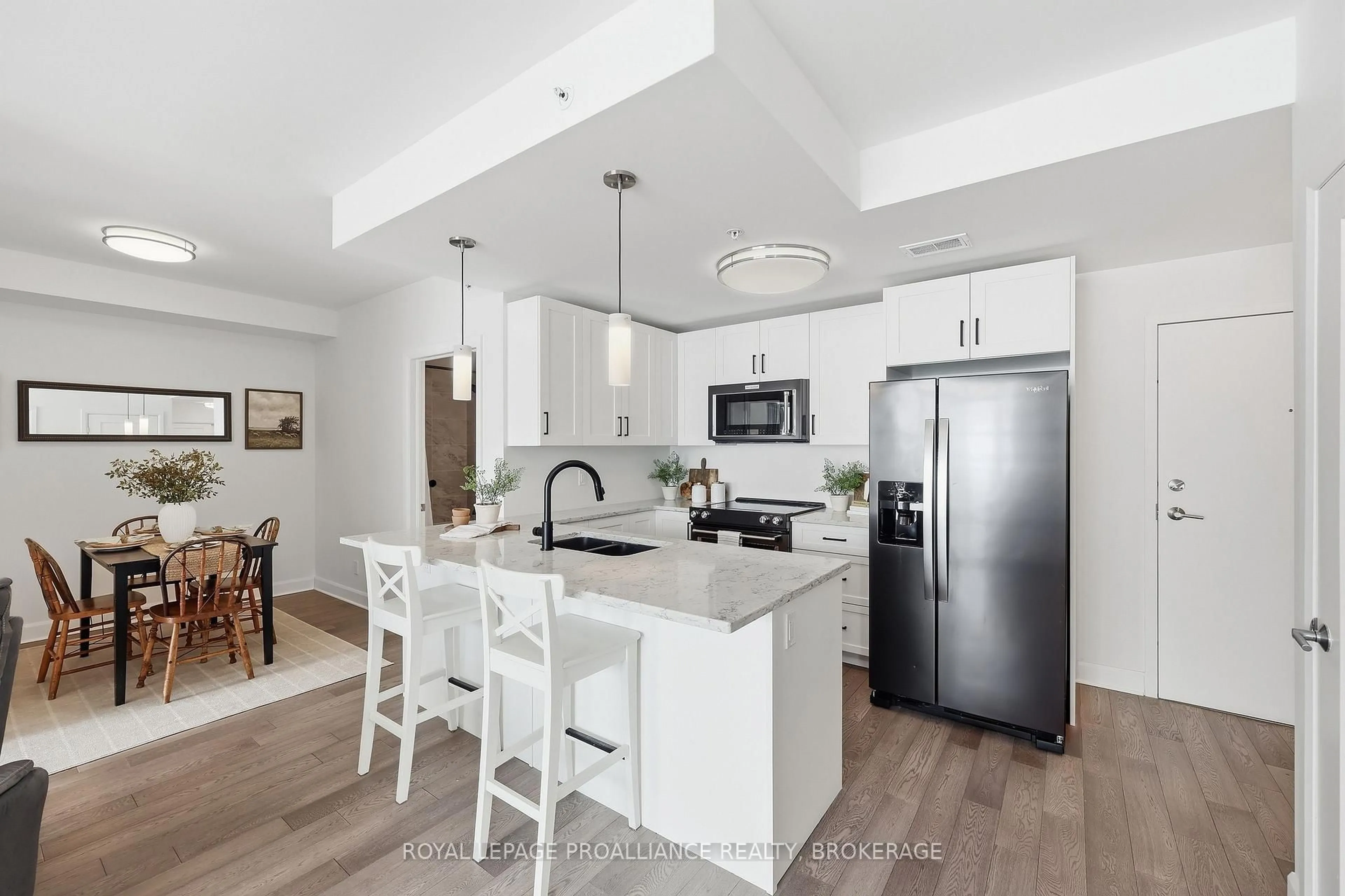 Open concept kitchen, ceramic/tile floor for 129A South St #410, Gananoque Ontario K7G 0A9