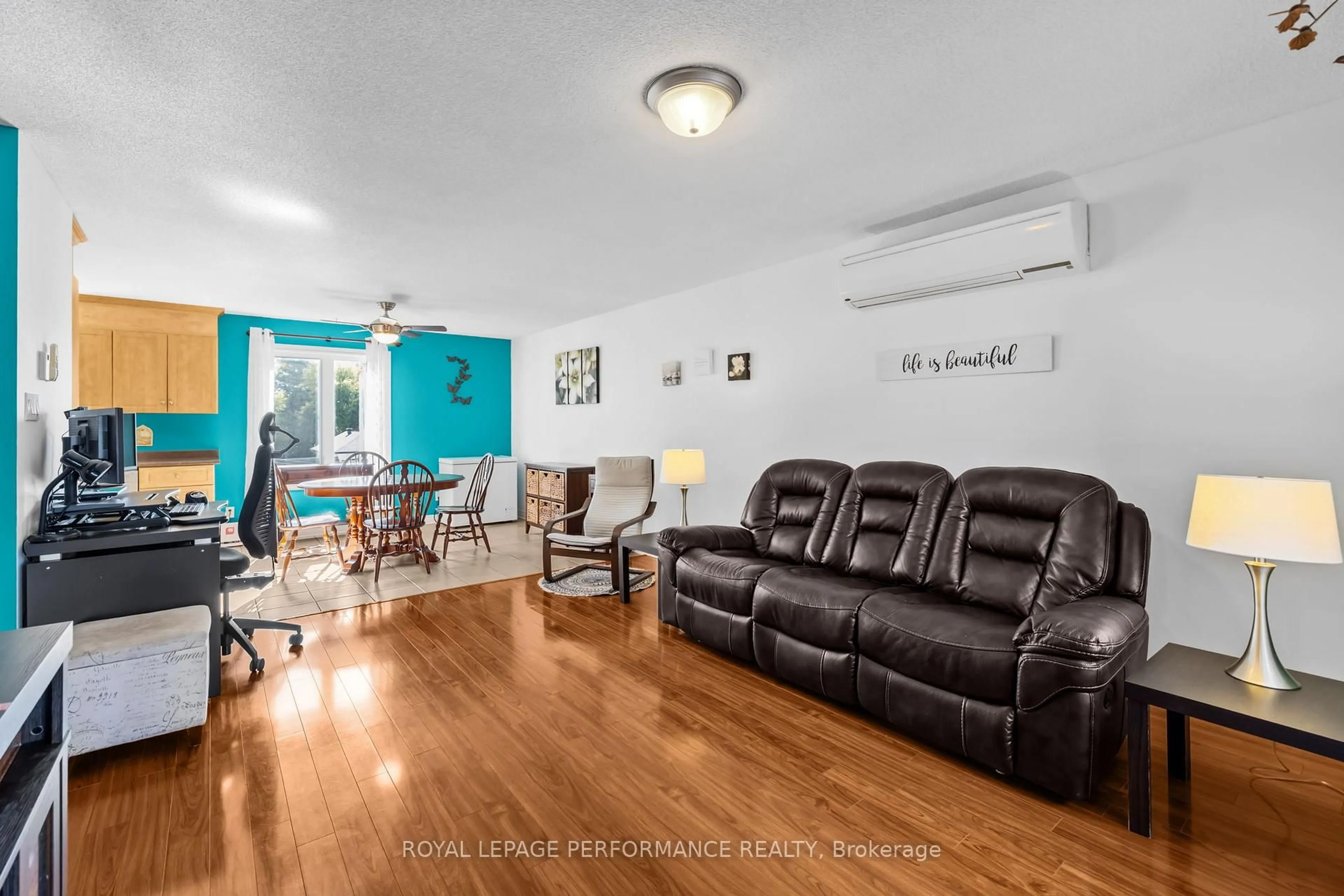 Living room with furniture, wood/laminate floor for 39 Main St #5, The Nation Ontario K0A 2M0