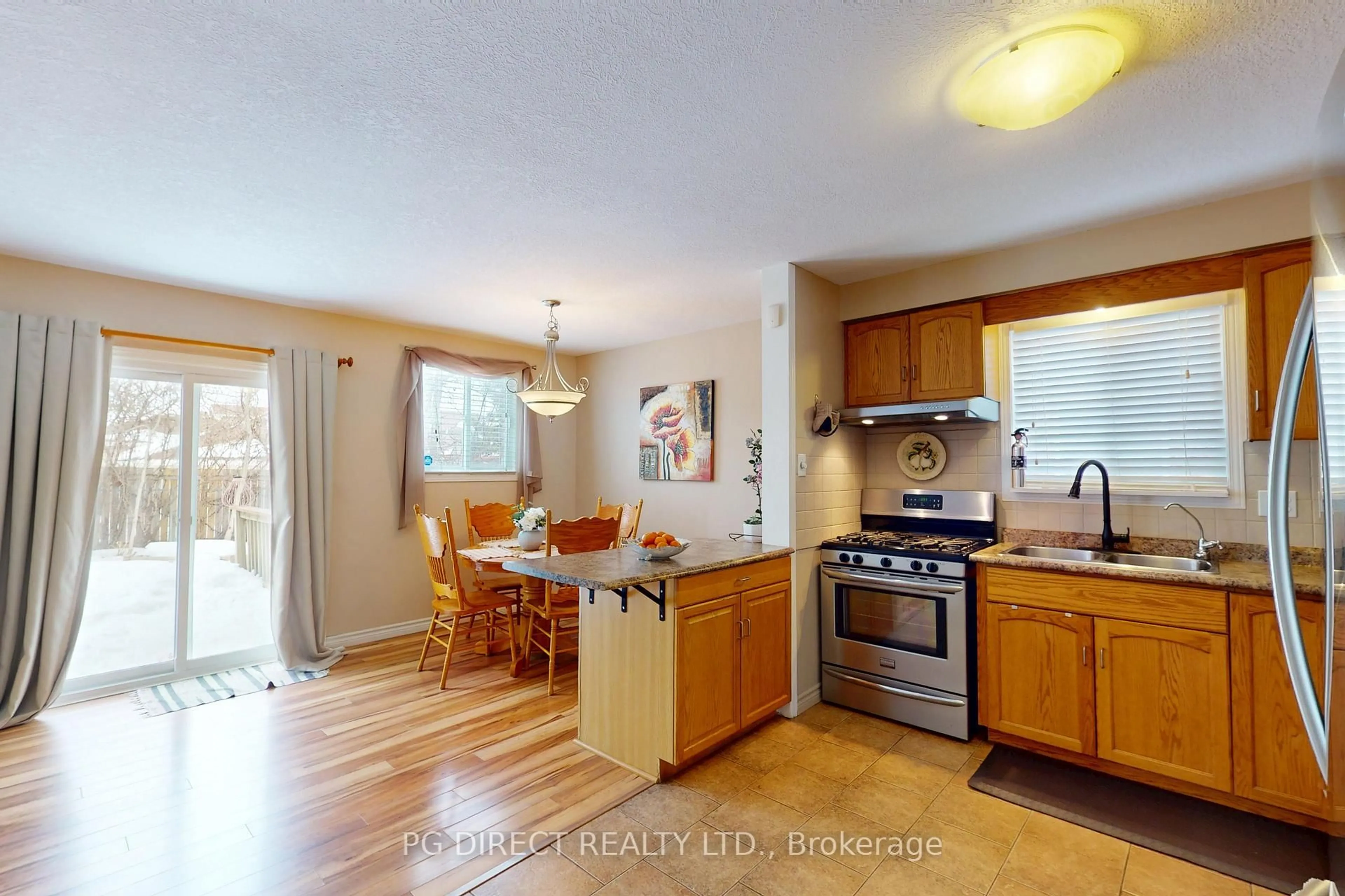Open concept kitchen, wood/laminate floor for 89 Inverness Dr, Guelph Ontario N1E 6E4