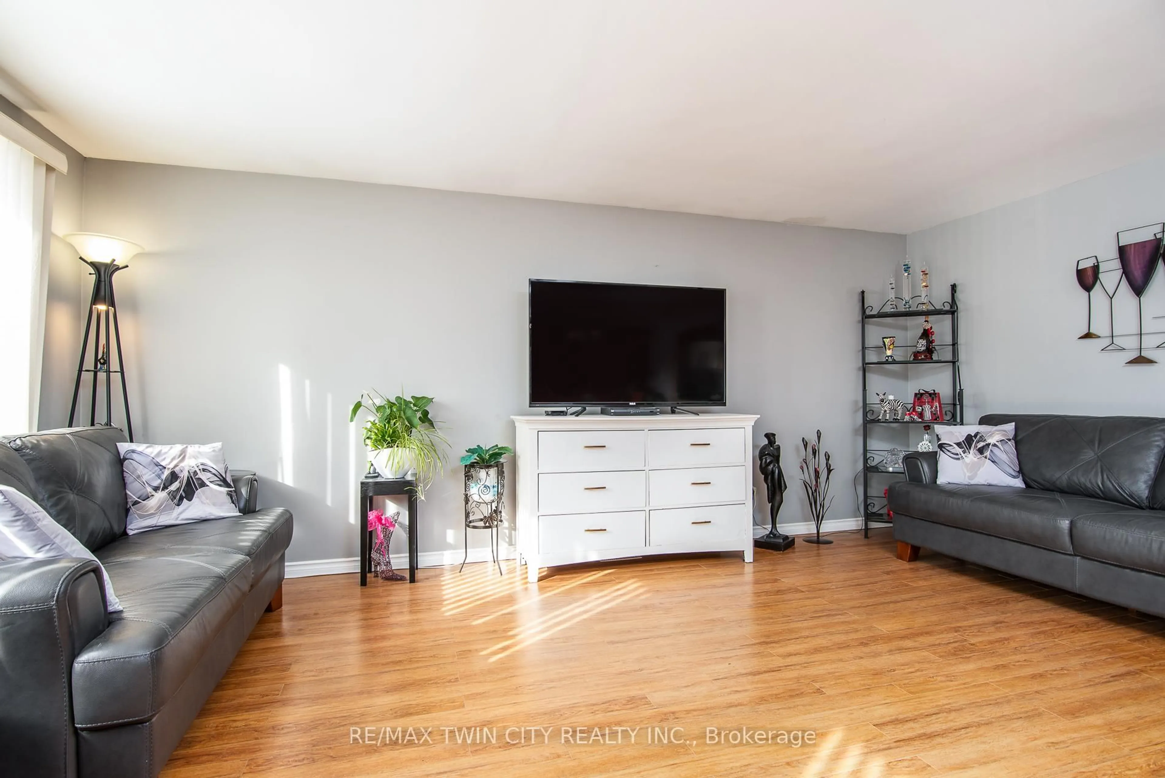 Living room with furniture, wood/laminate floor for 72 Manor Dr, Kitchener Ontario N2A 2V1