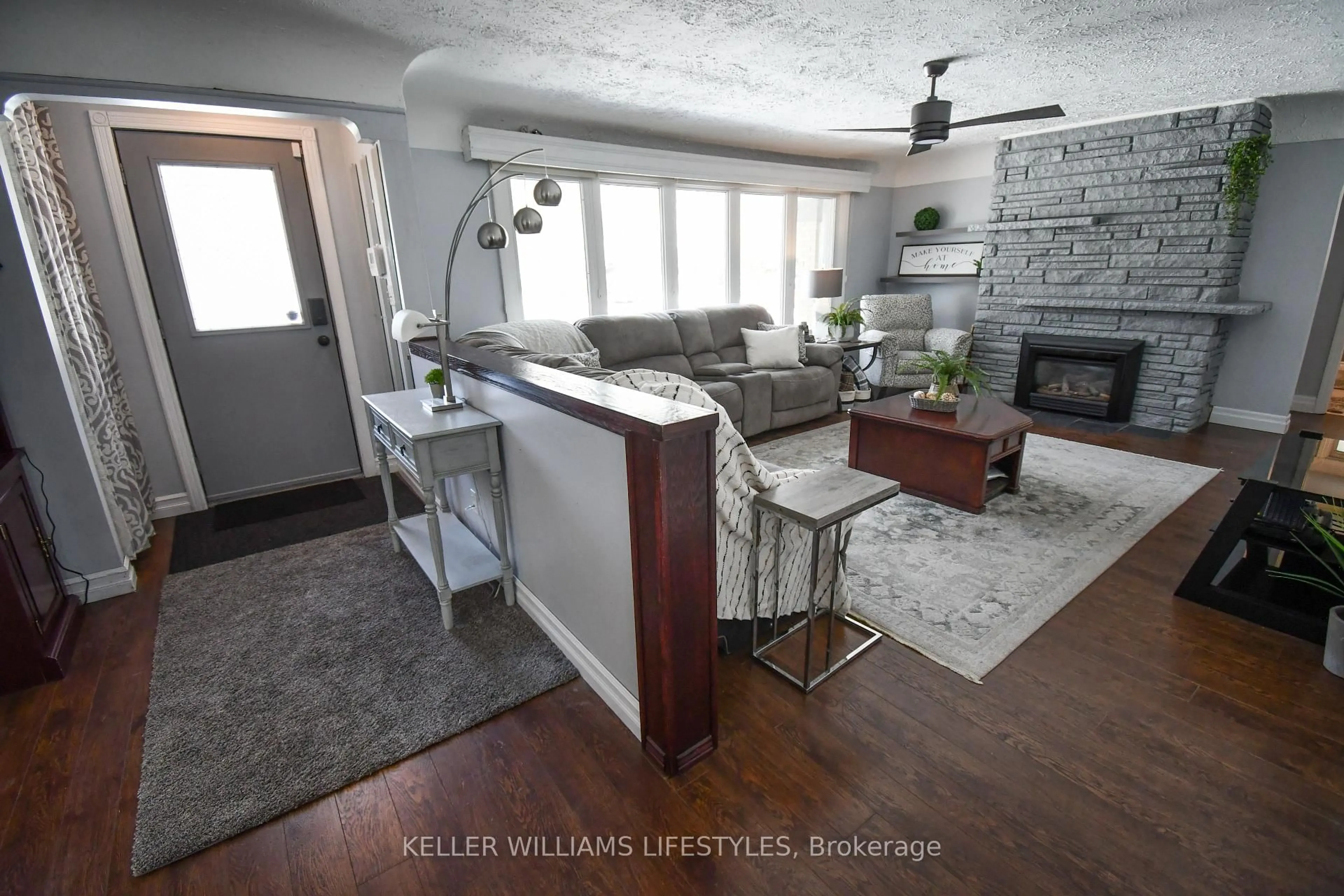 Living room with furniture, wood/laminate floor for 345 Glenrose Dr, London South Ontario N6K 2A9