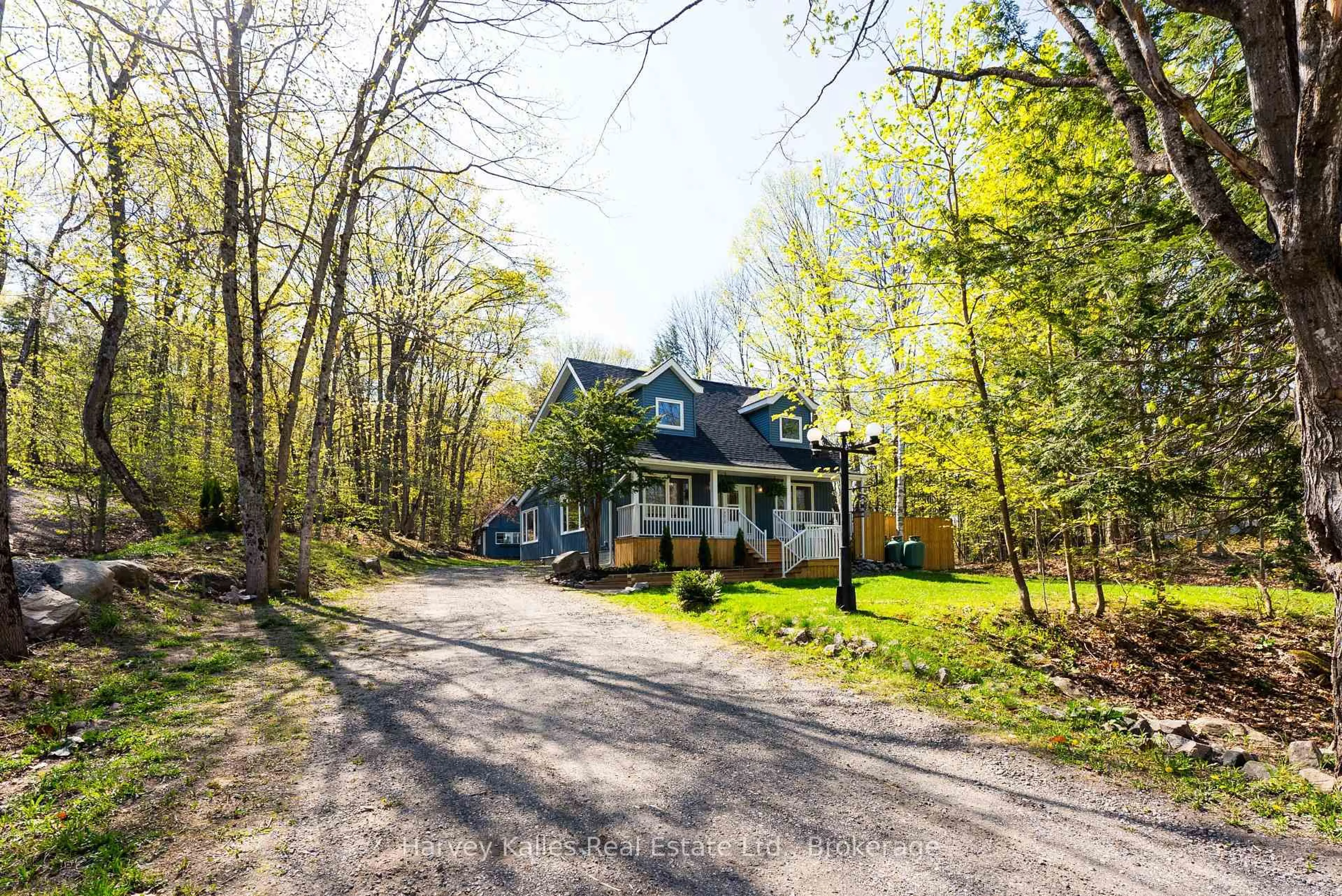A pic from outside/outdoor area/front of a property/back of a property/a pic from drone, street for 21 Todholm Dr, Muskoka Lakes Ontario P0B 1J0