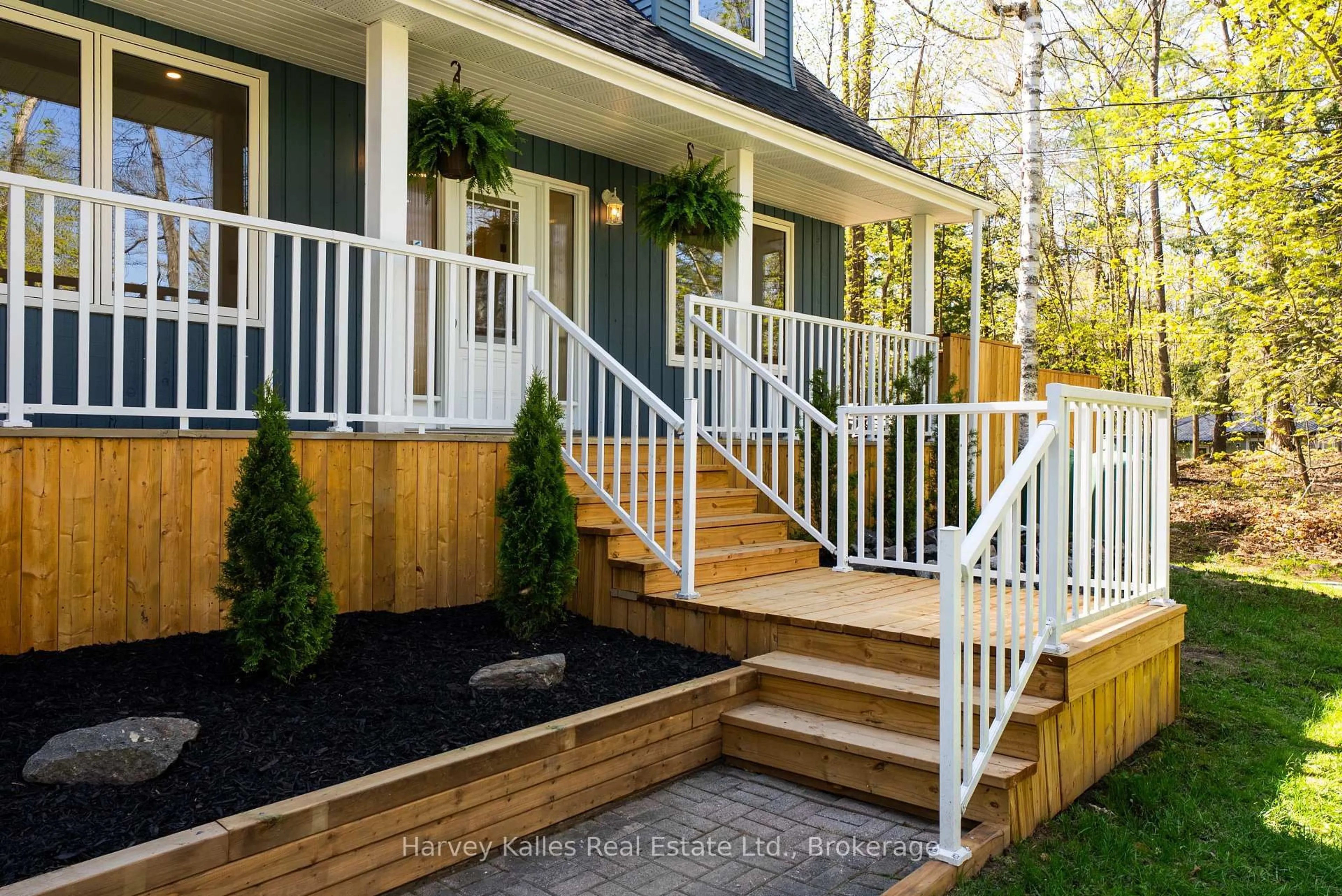 Home with vinyl exterior material, street for 21 Todholm Dr, Muskoka Lakes Ontario P0B 1J0