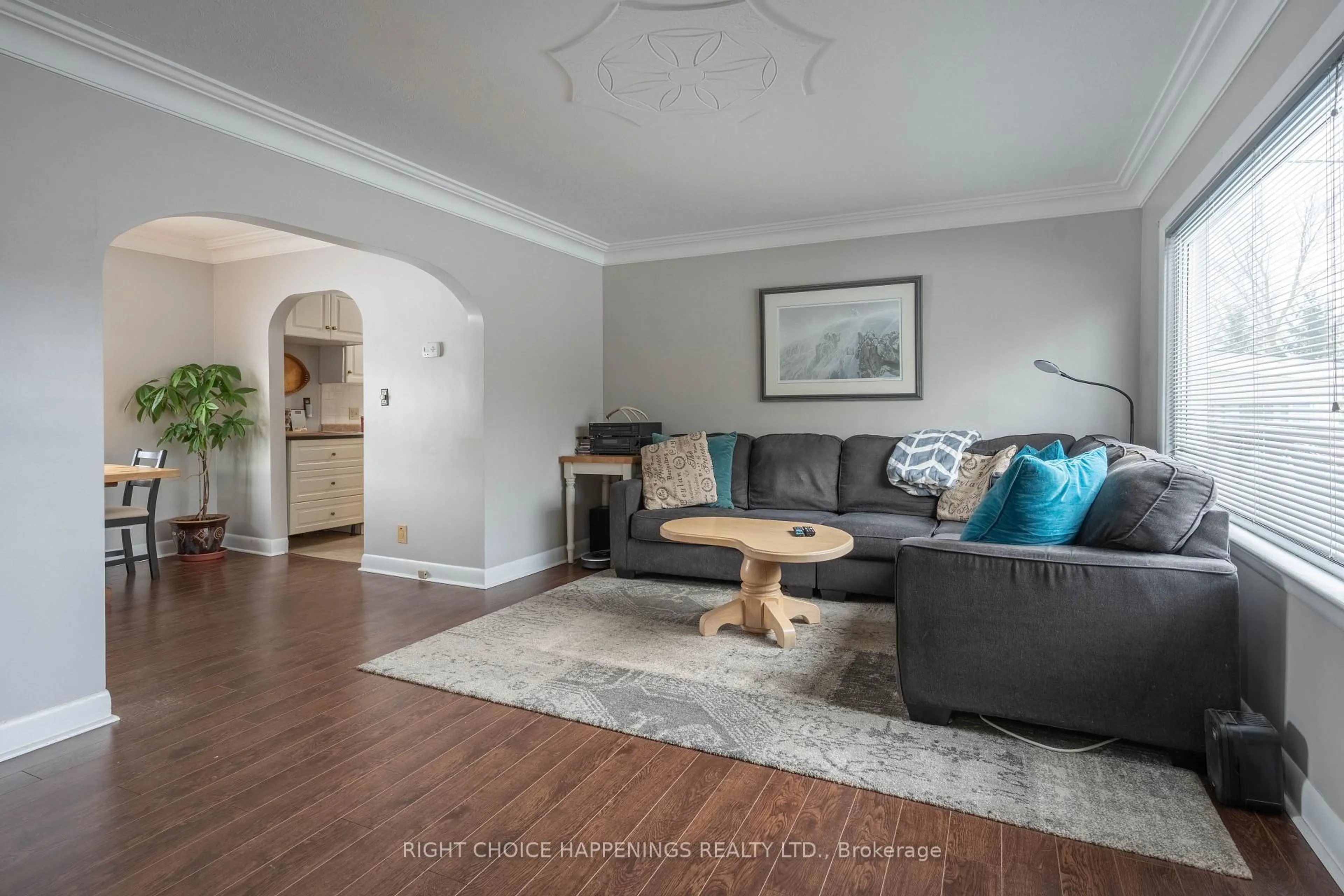 Living room with furniture, wood/laminate floor for 63058 Perry Rd, Wainfleet Ontario L0S 1V0