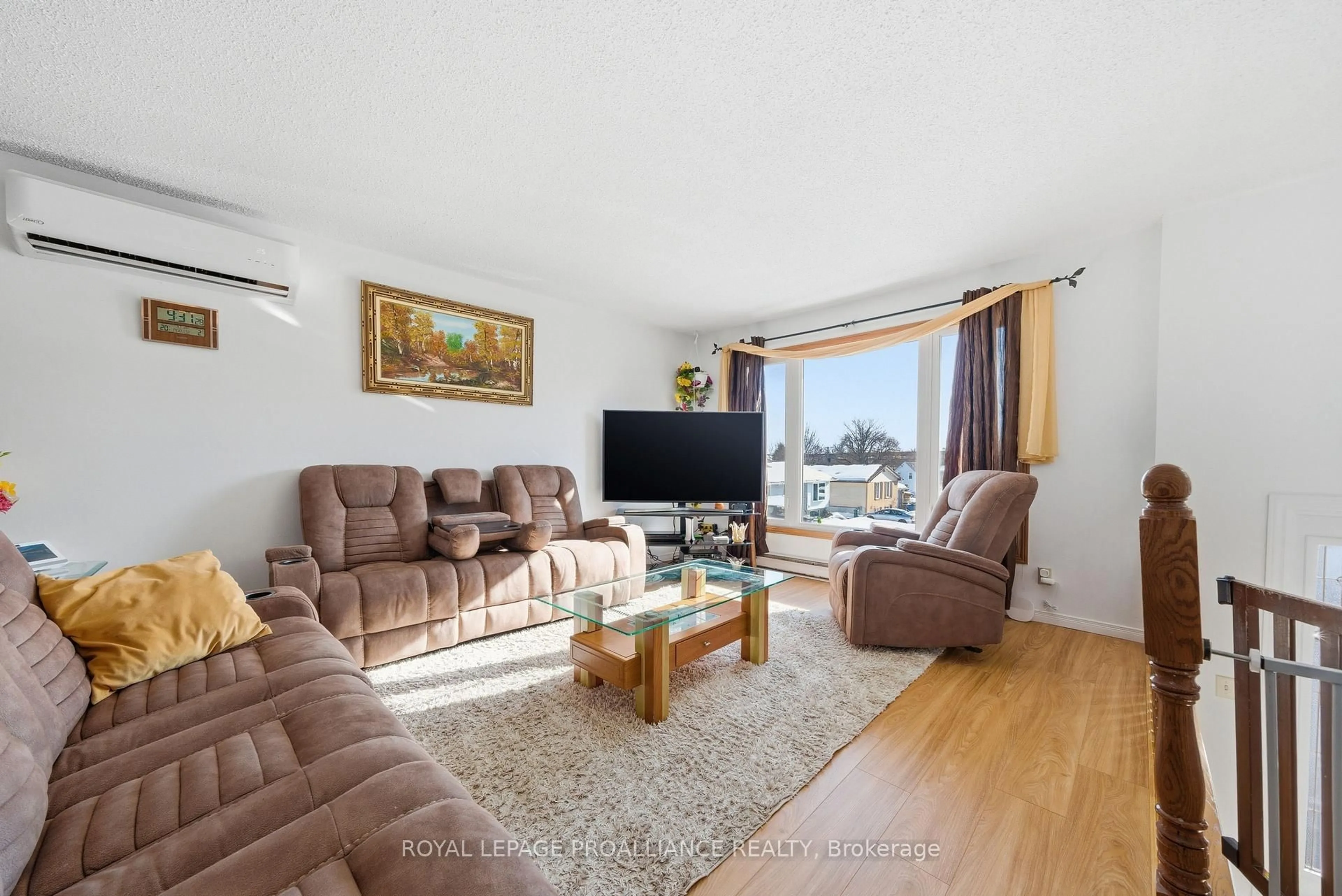 Living room with furniture, wood/laminate floor for 19 Allore Ave, Quinte West Ontario K8V 6K2