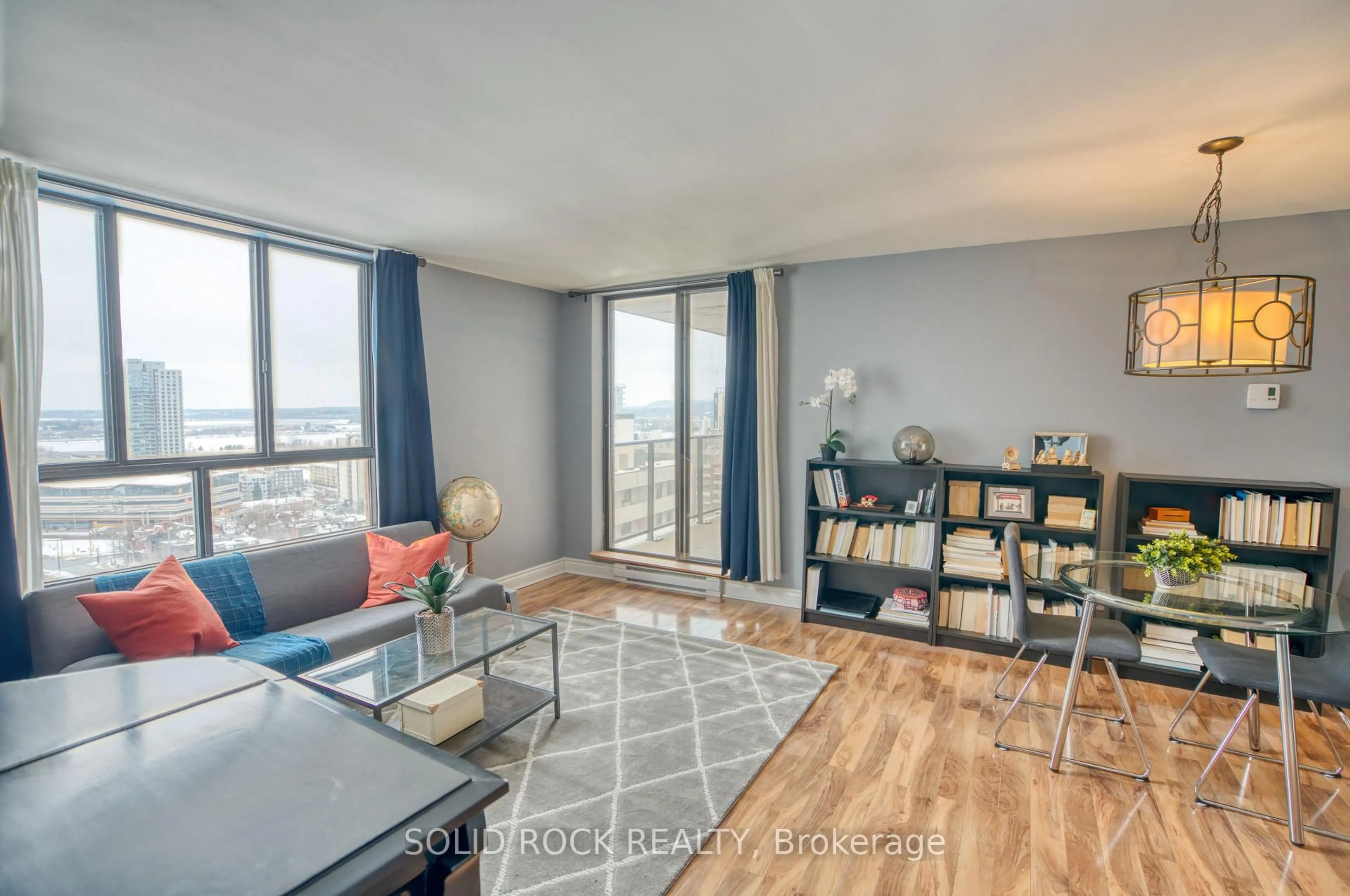 Living room with furniture, wood/laminate floor for 475 Laurier Ave #1907, Ottawa Ontario K1R 7X1