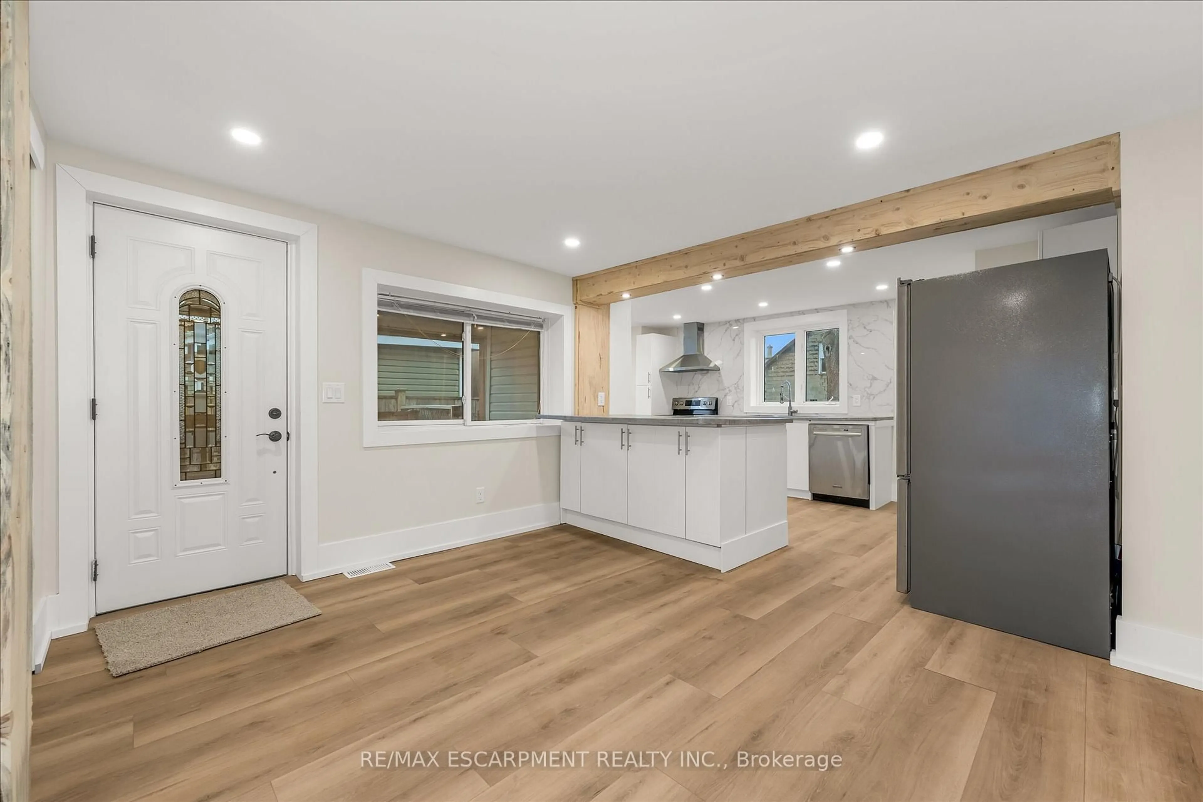 Open concept kitchen, wood/laminate floor for 11 Albina St, Welland Ontario L3C 1P2