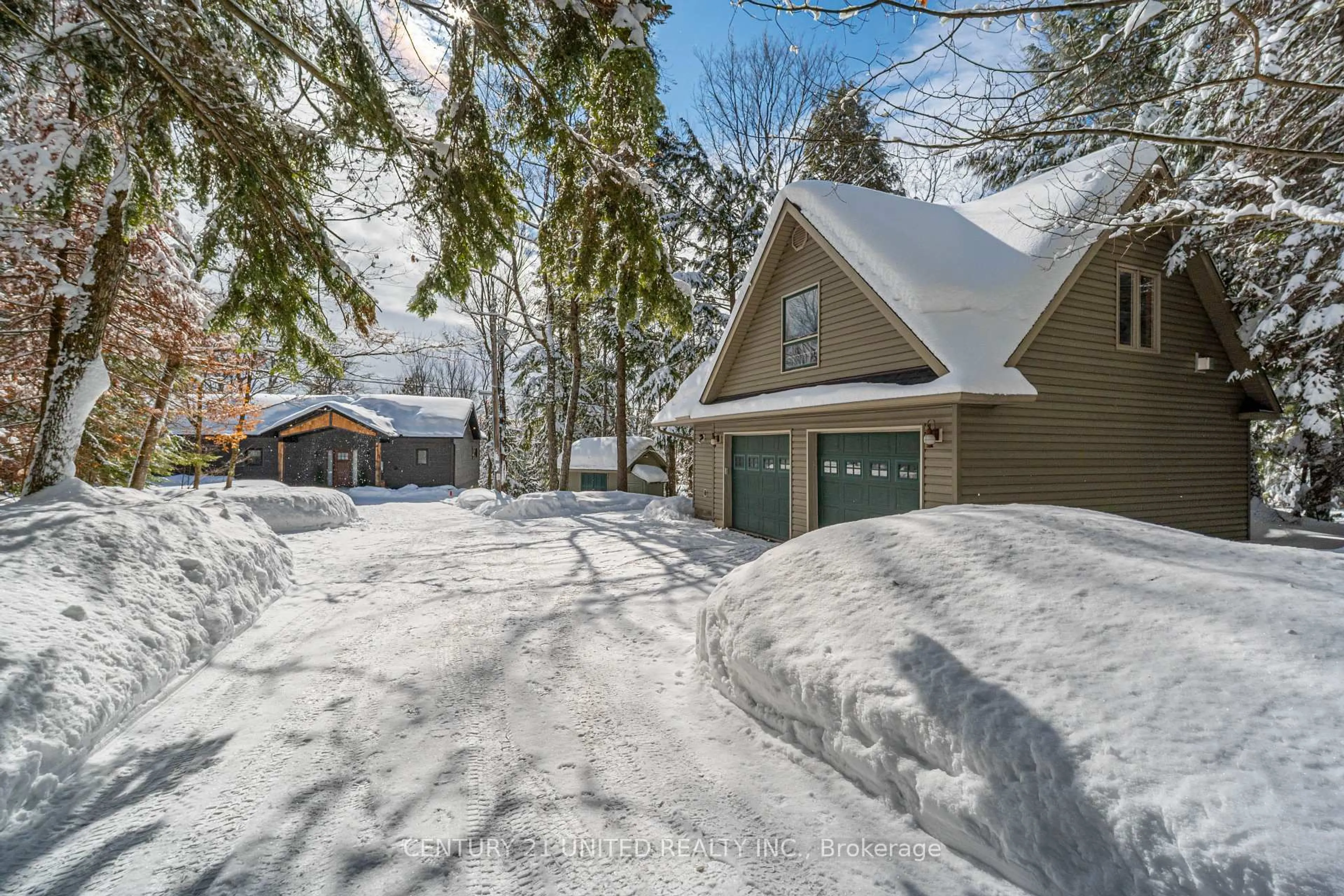 A pic from outside/outdoor area/front of a property/back of a property/a pic from drone, street for 1047 Hinterland Tr, Highlands East Ontario K0L 1C0