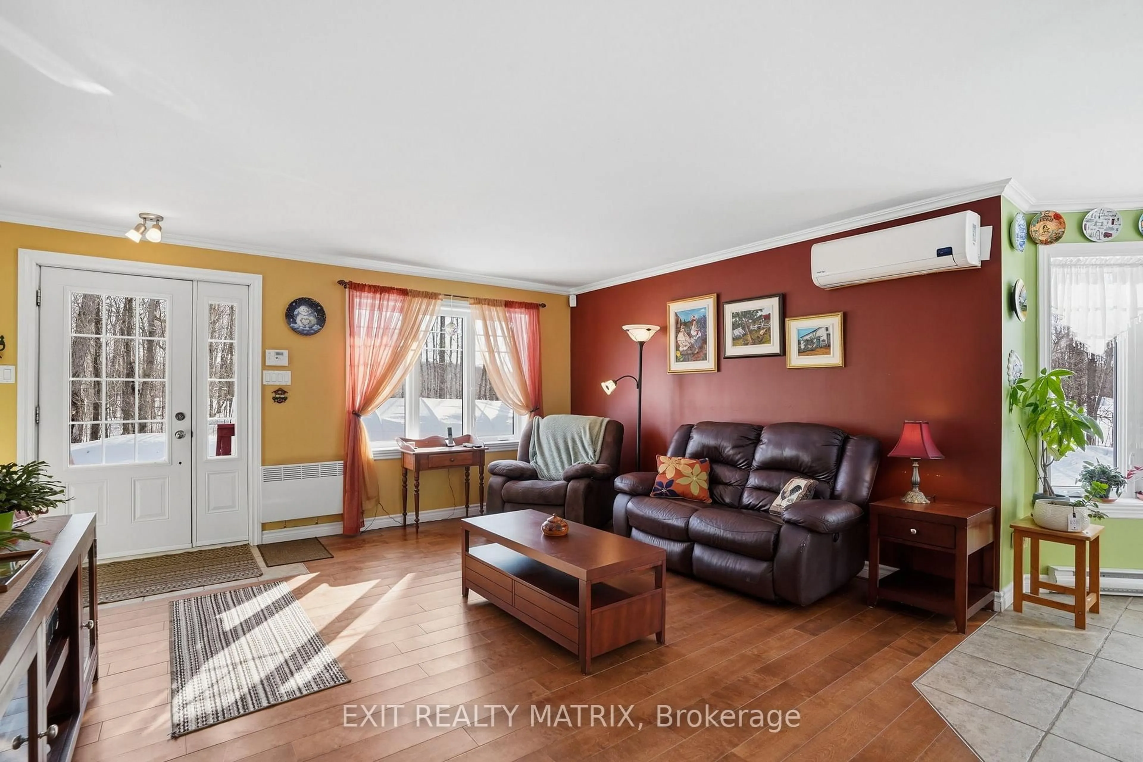 Living room with furniture, wood/laminate floor for 8150 Montee Lemieux Rd, East Hawkesbury Ontario K0B 1M0