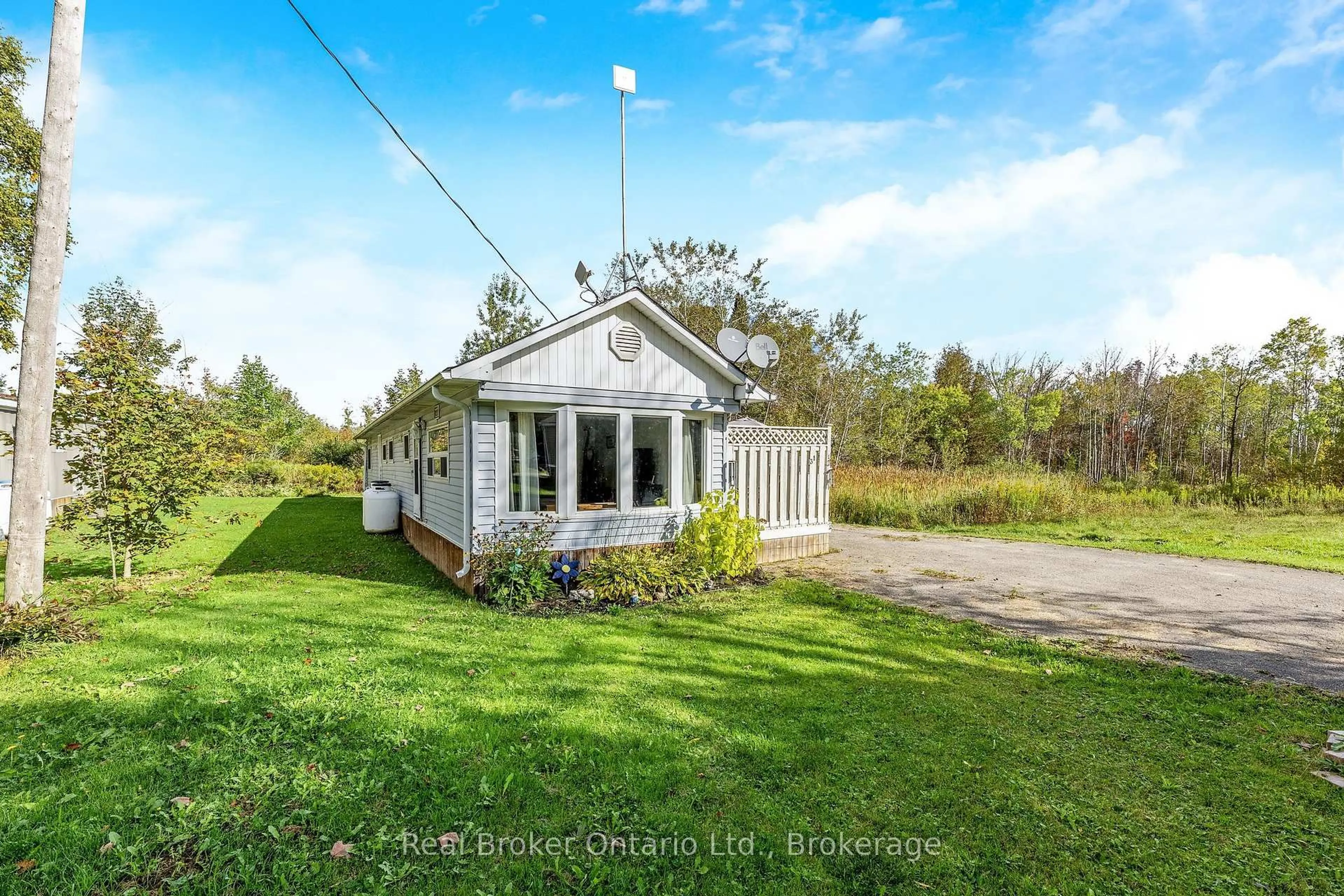 A pic from outside/outdoor area/front of a property/back of a property/a pic from drone, water/lake/river/ocean view for 026585 89 Highway #31, Southgate Ontario N0C 1B0