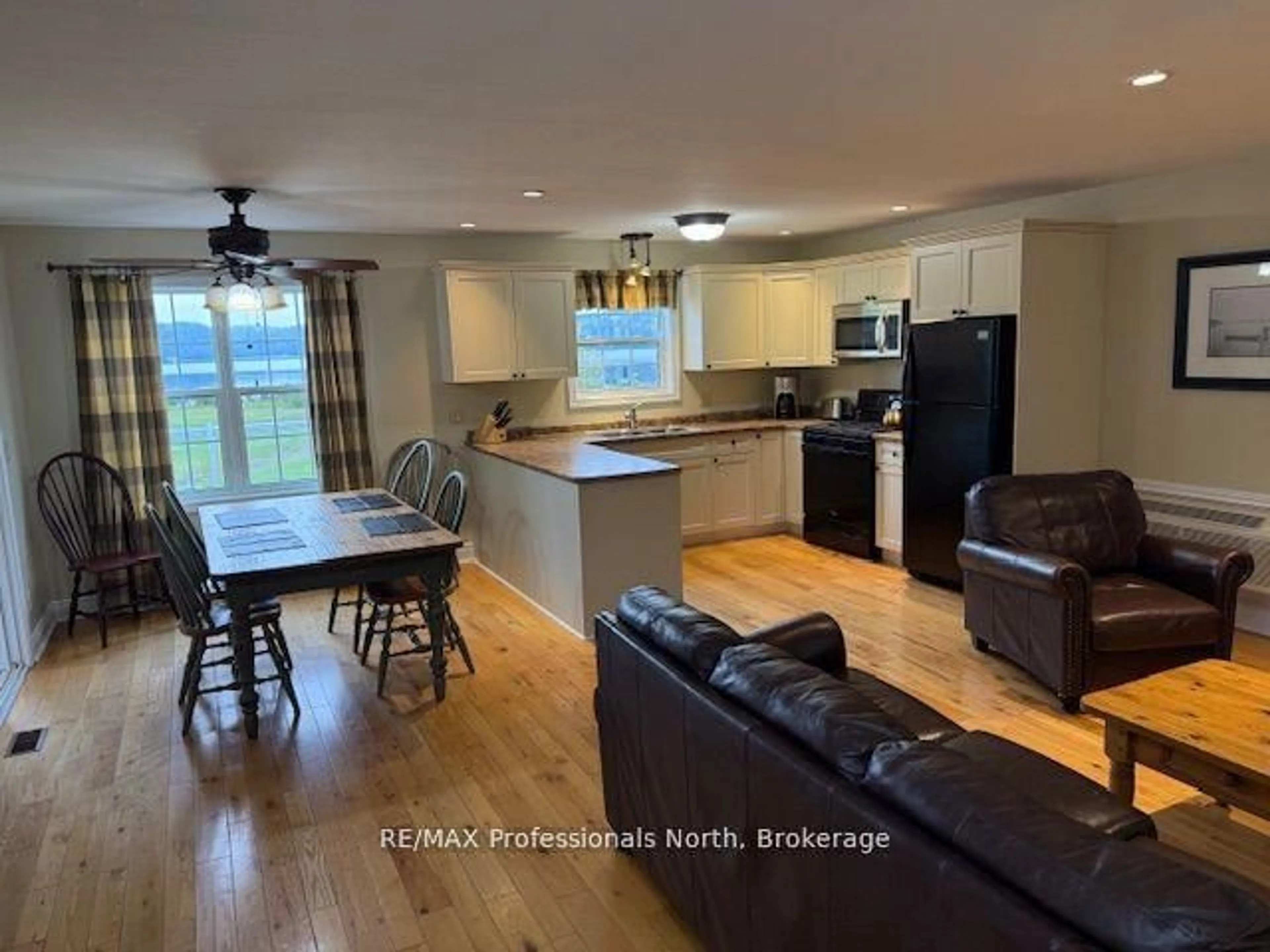 Open concept kitchen, wood/laminate floor for 1052 Rat Bay Rd #126-5, Lake of Bays Ontario P0A 1H0