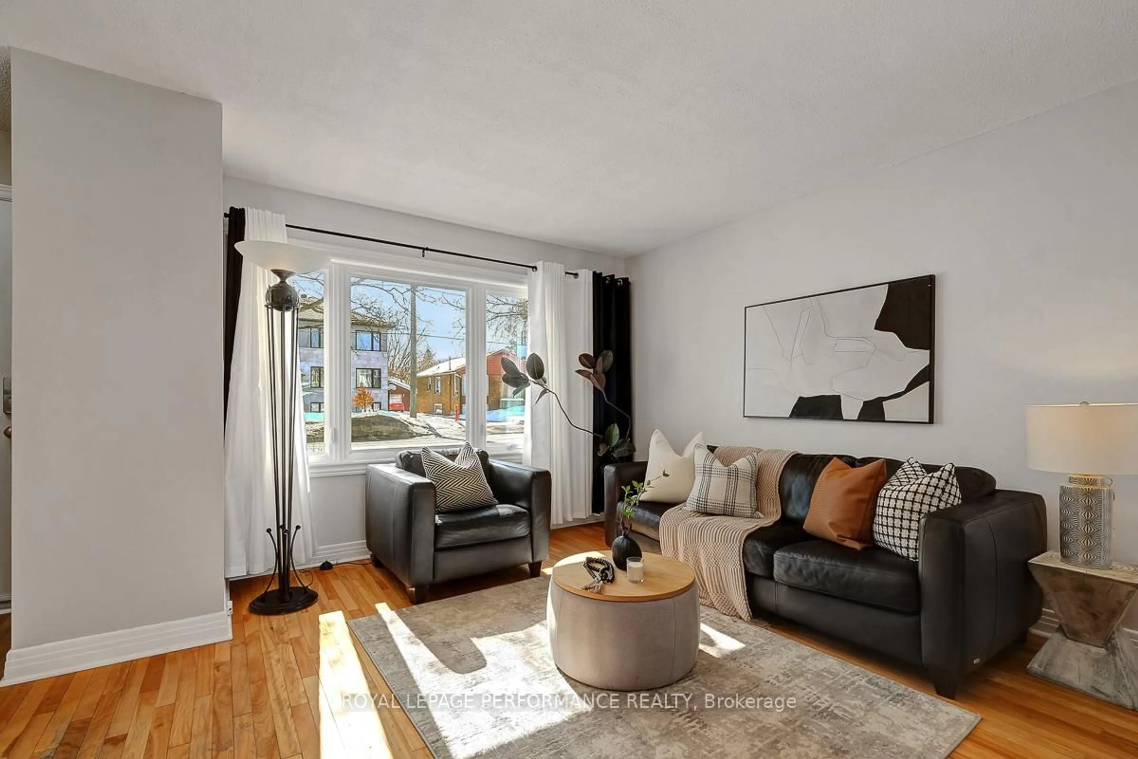 Living room with furniture, wood/laminate floor for 321 Donald St, Ottawa Ontario K1K 1M4