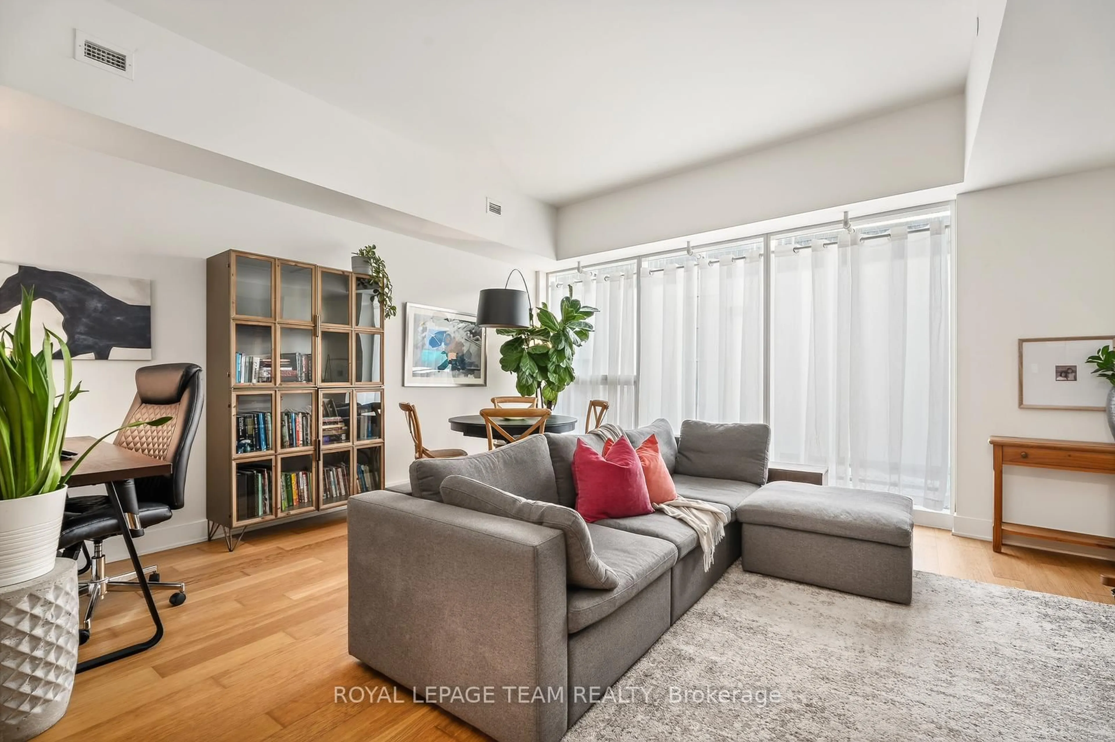 Living room with furniture, unknown for 485 Richmond Rd #103, Ottawa Ontario K2A 3W9