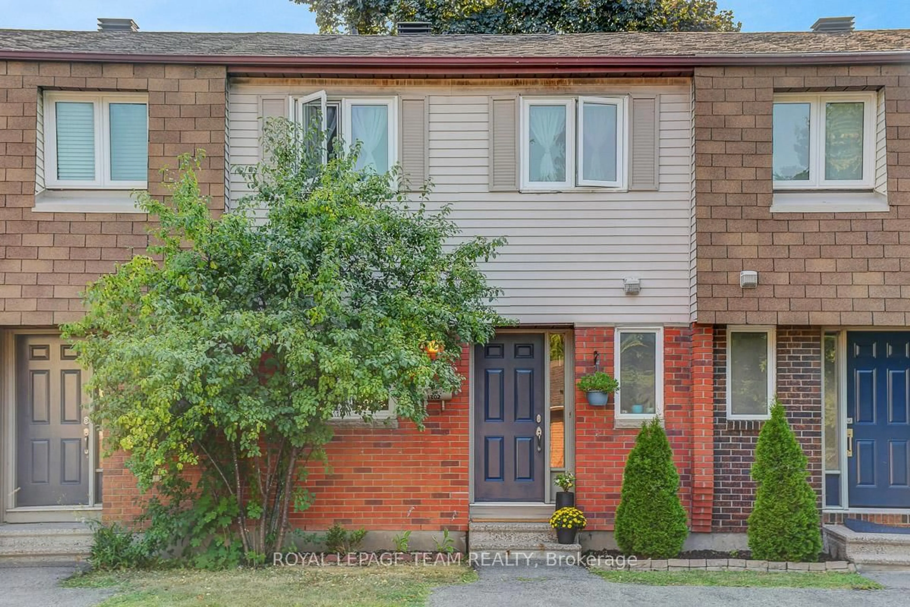 Home with brick exterior material, street for 1302 Alness Crt #15, Ottawa Ontario K1B 5H2