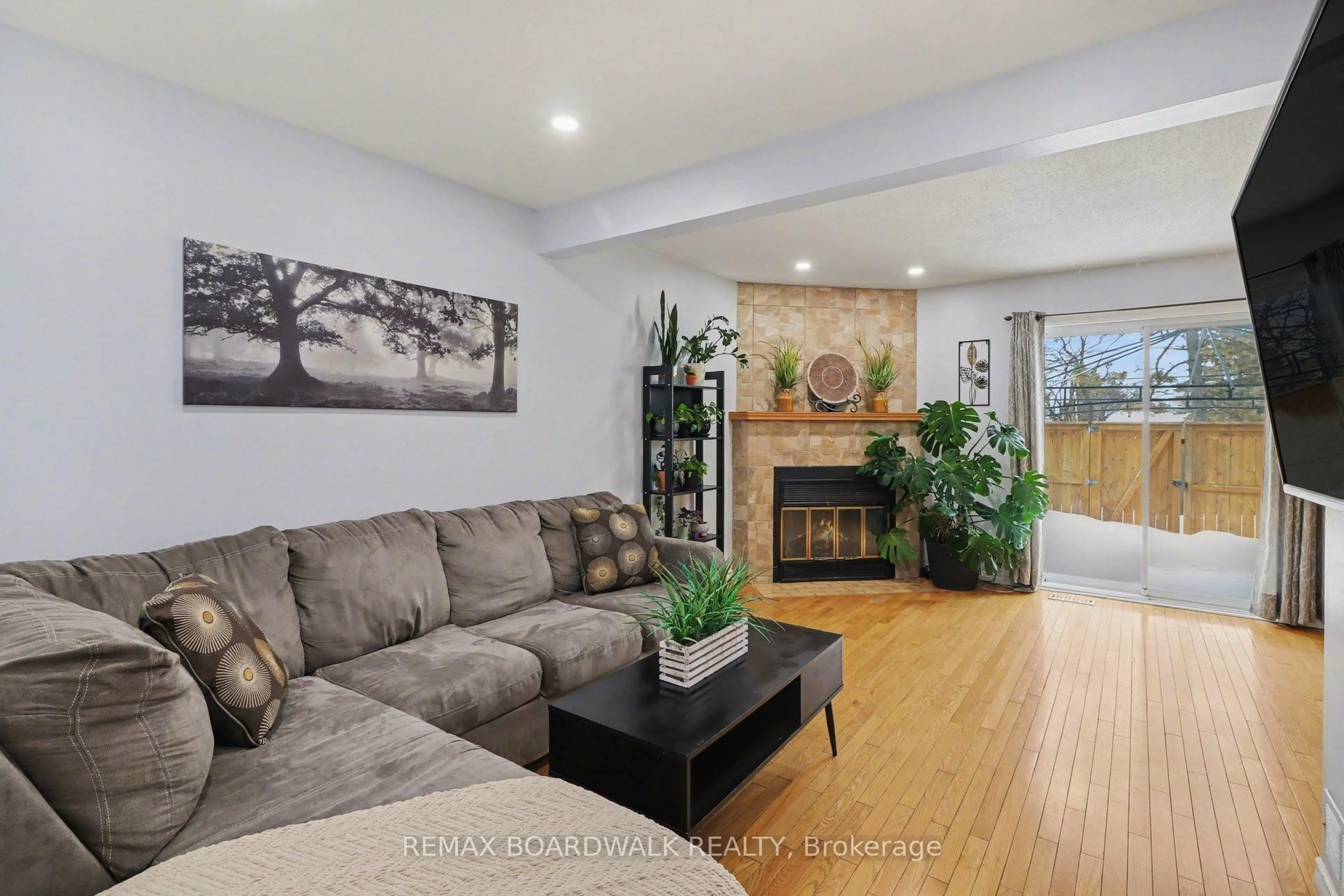 Living room with furniture, wood/laminate floor for 443 Canotia Pl #3, Ottawa Ontario K4A 2K1