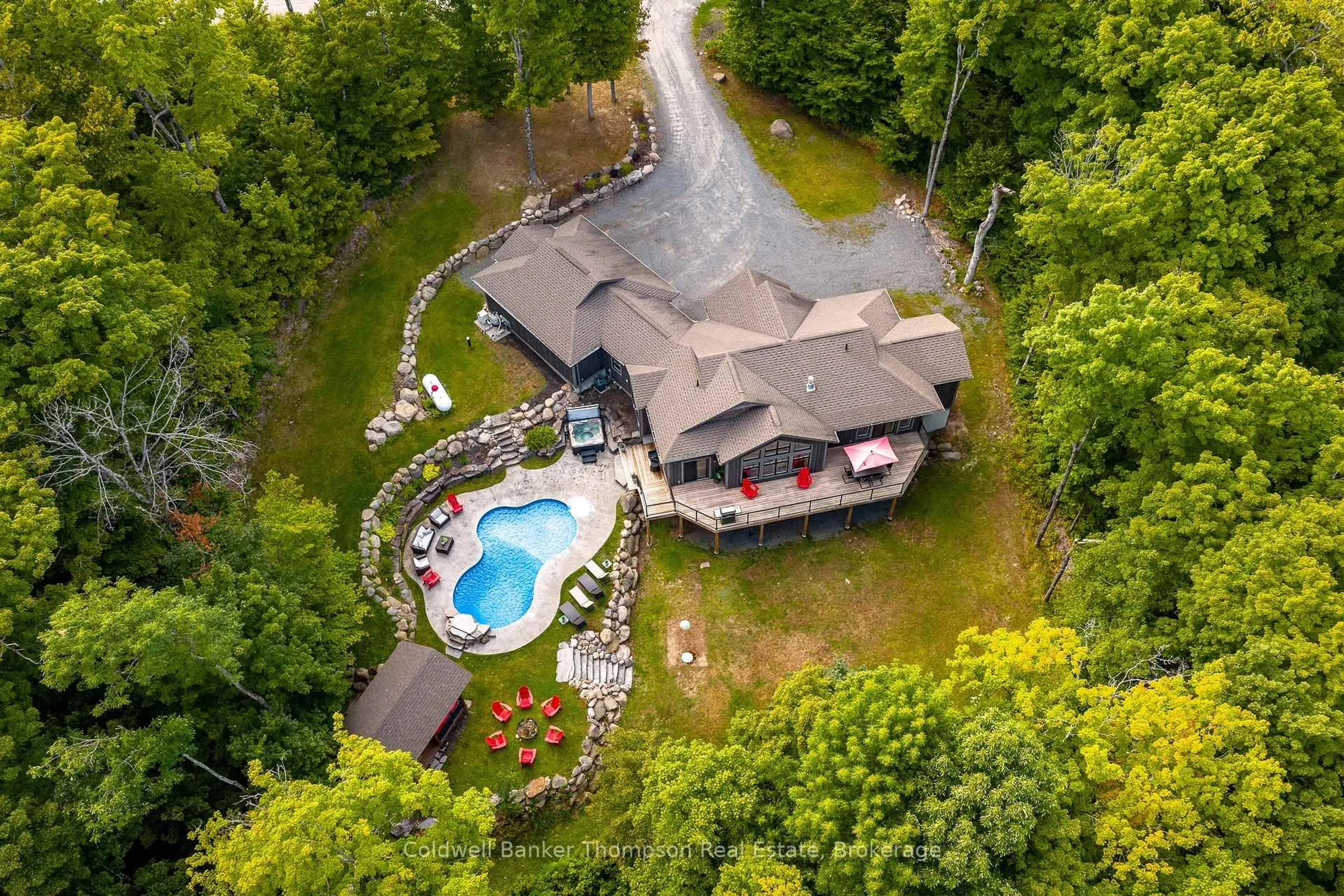 A pic from outside/outdoor area/front of a property/back of a property/a pic from drone, water/lake/river/ocean view for 15 Forest Hill Lane, Huntsville Ontario P1H 2N5