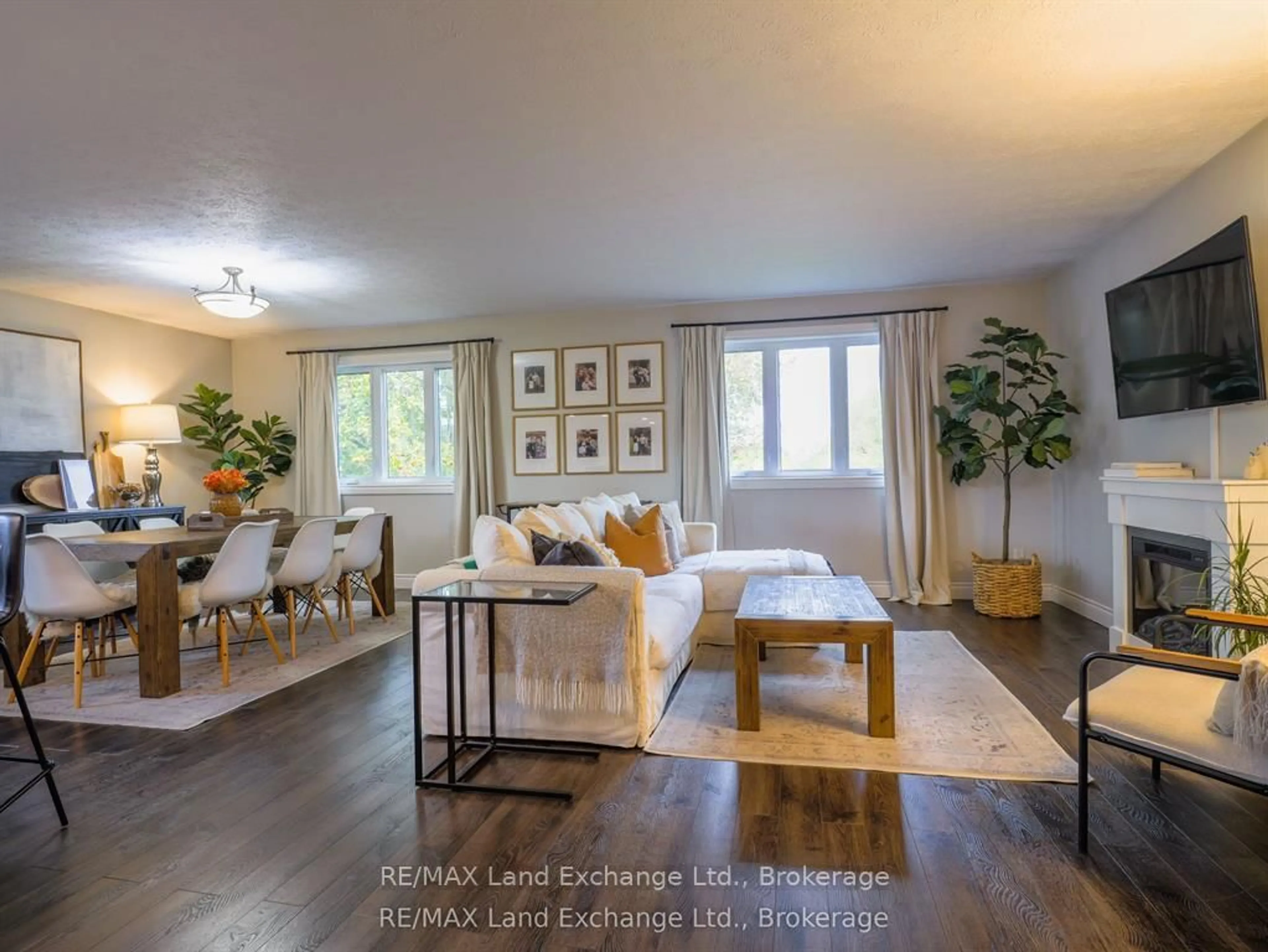 Living room with furniture, wood/laminate floor for 829 Highland St, Saugeen Shores Ontario N0H 2C2