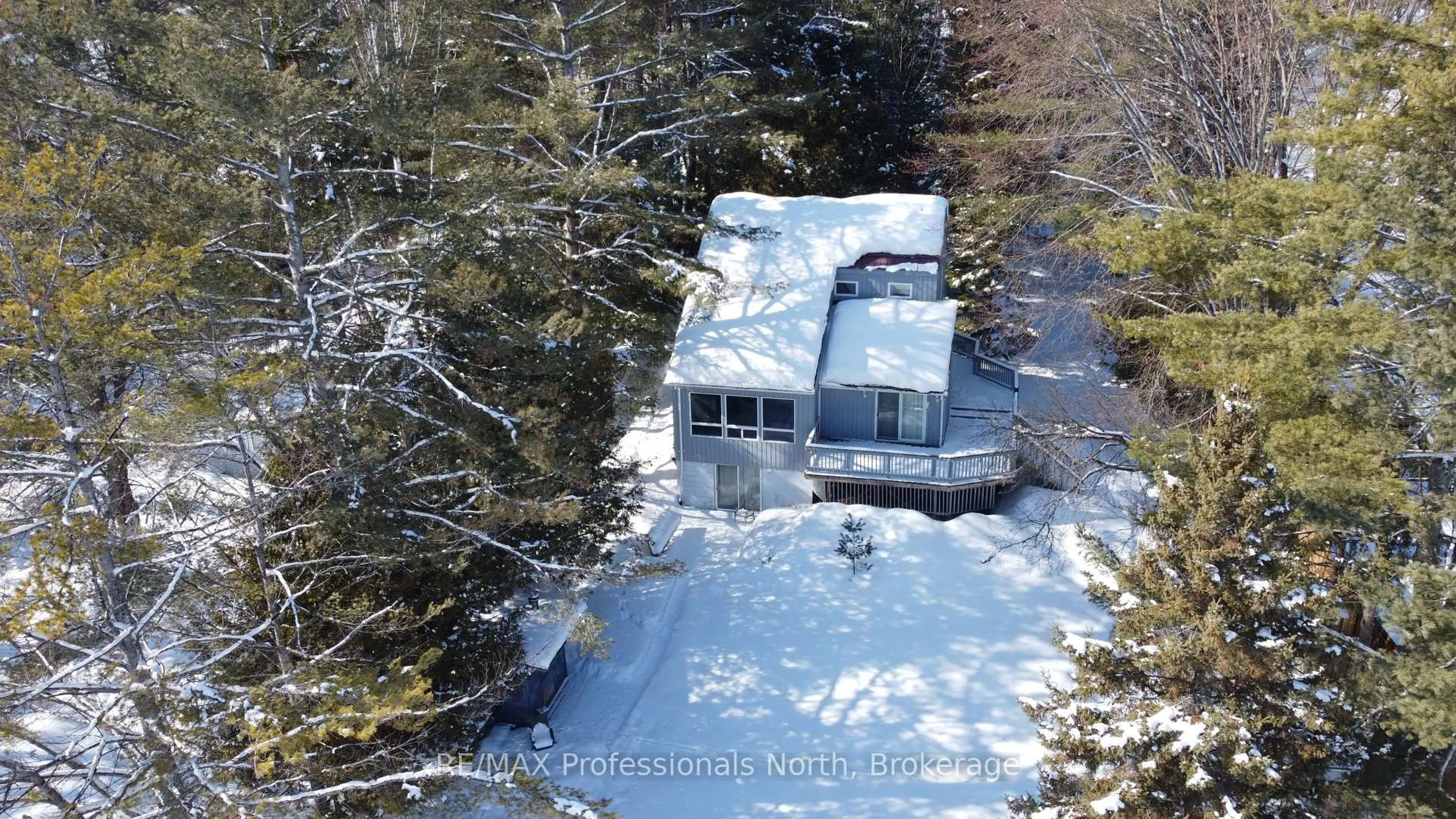 A pic from outside/outdoor area/front of a property/back of a property/a pic from drone, water/lake/river/ocean view for 1080 Petticoat Lane, Minden Hills Ontario K0M 2K0