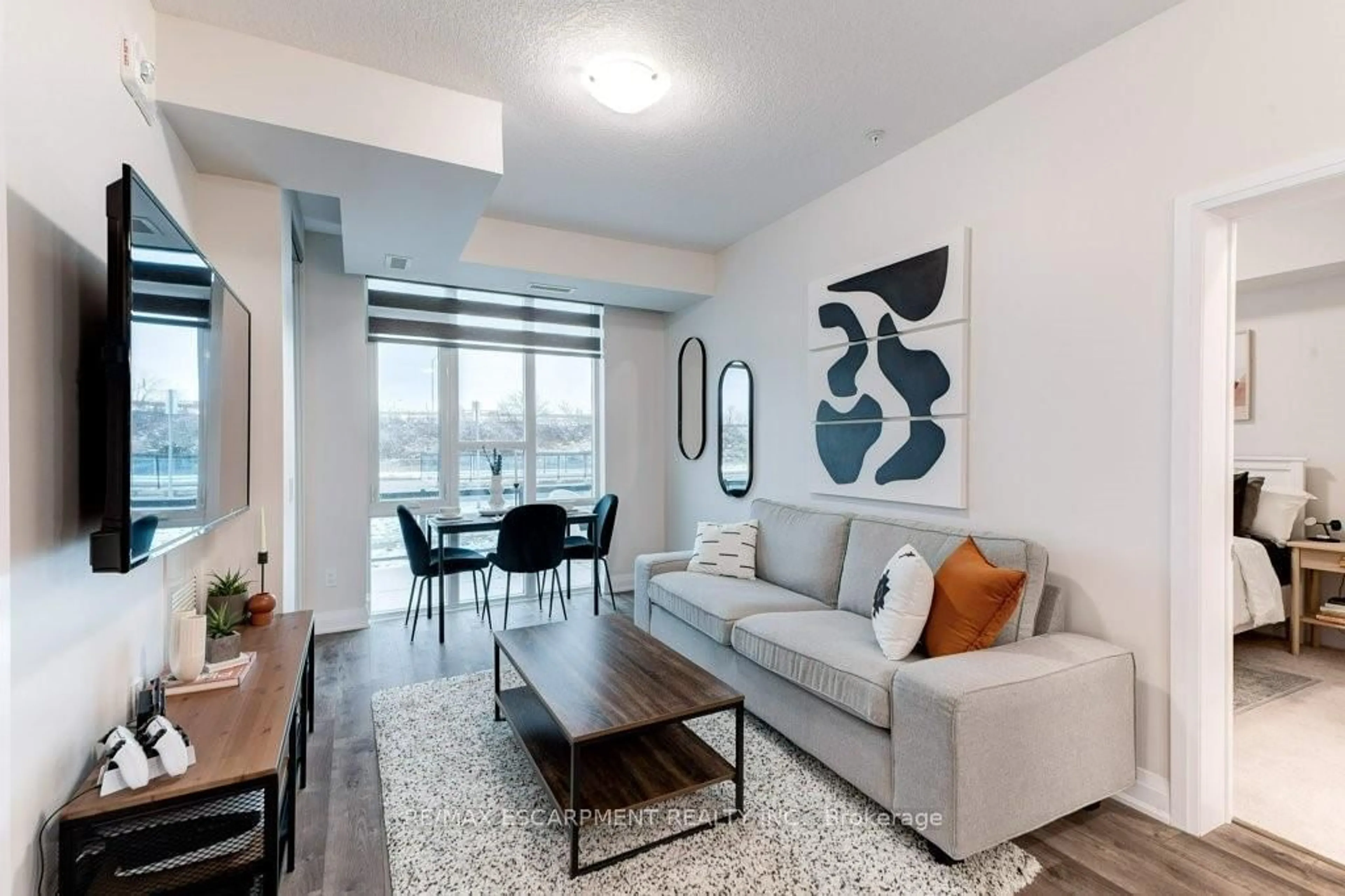 Living room with furniture, unknown for 16 Concord Pl #123, Grimsby Ontario L3M 0J1