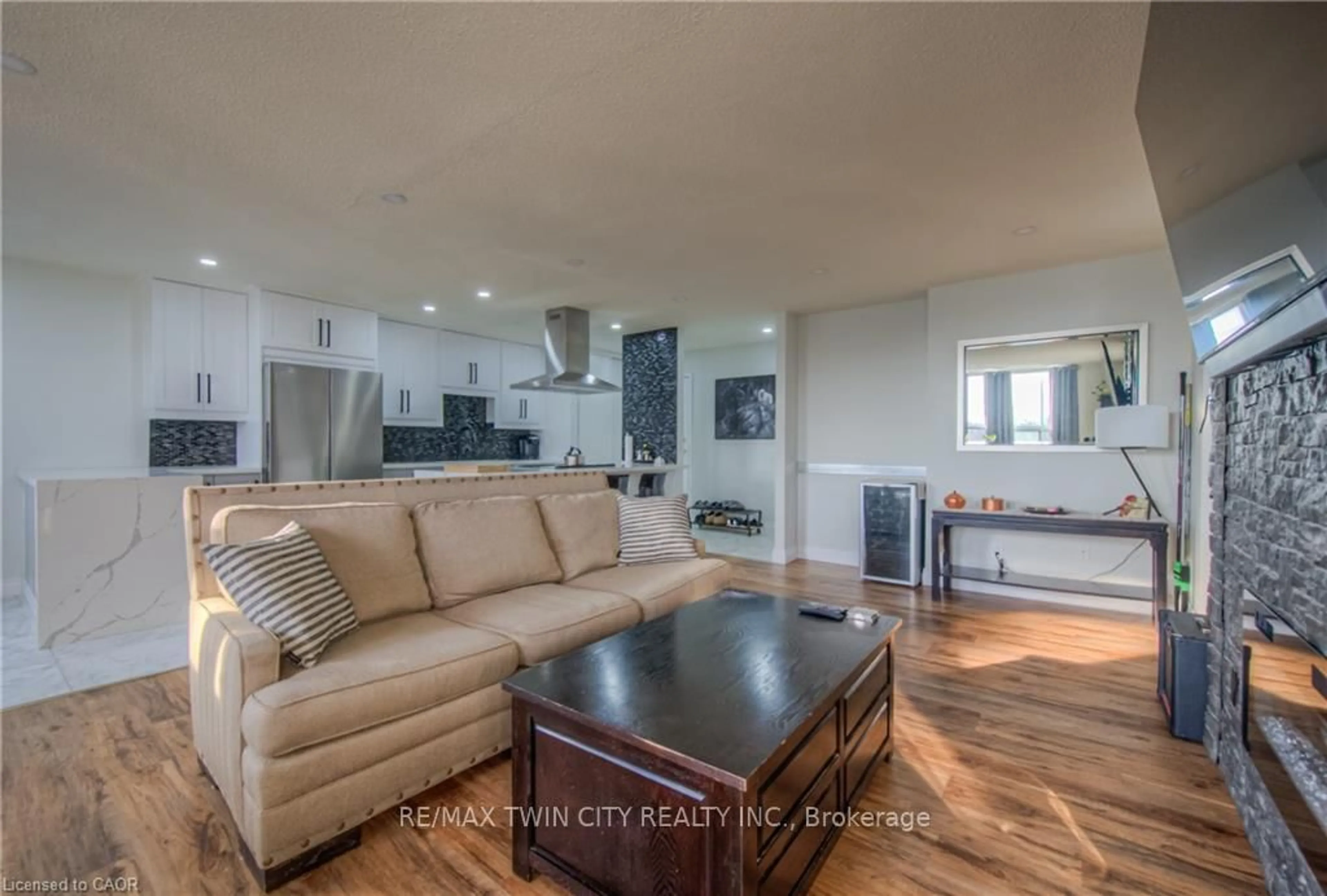 Living room with furniture, wood/laminate floor for 185 Kehl St #410, Kitchener Ontario N2M 5B9