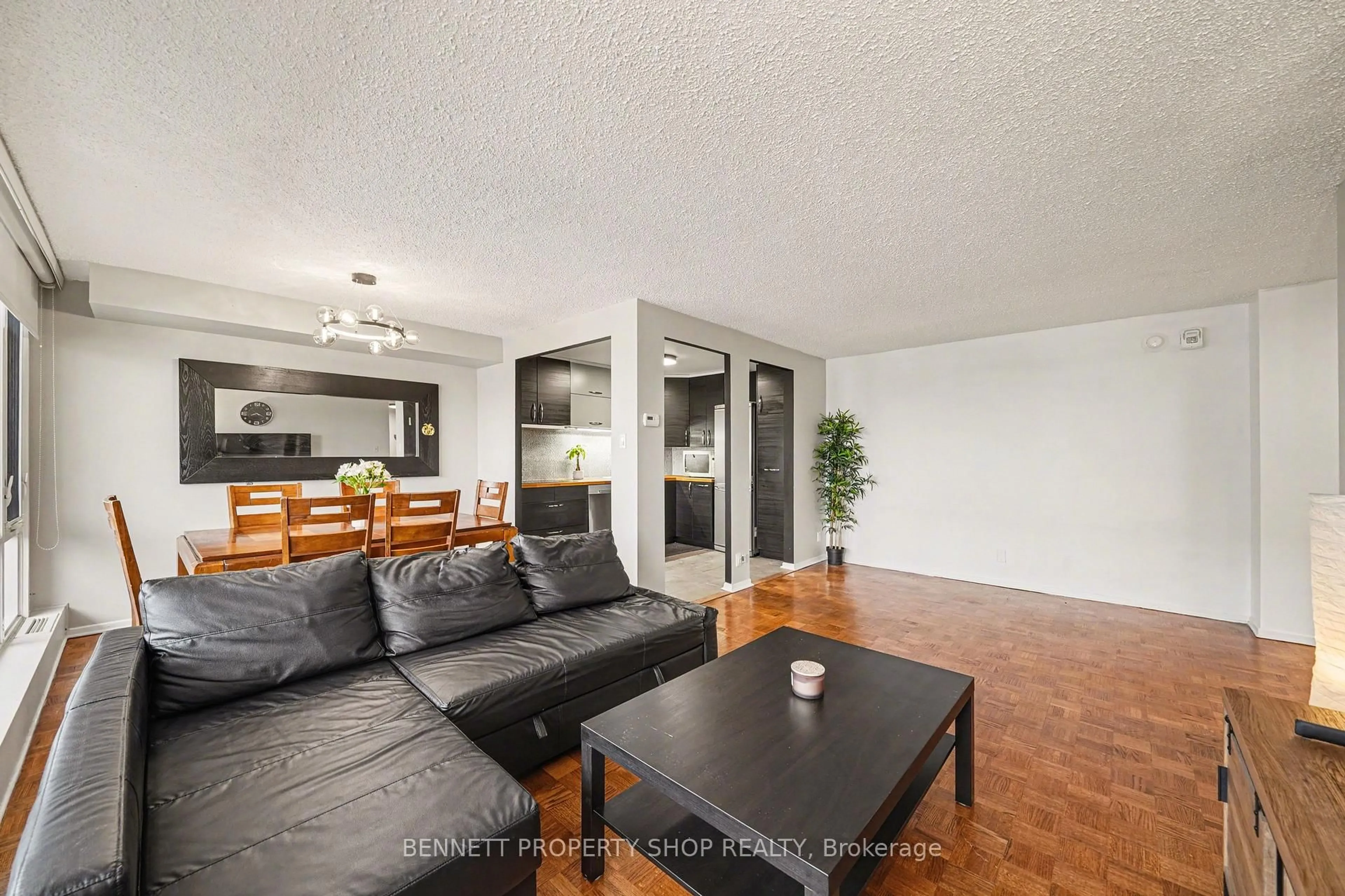 Living room with furniture, wood/laminate floor for 2625 Regina St #1209, Ottawa Ontario K2B 5W8