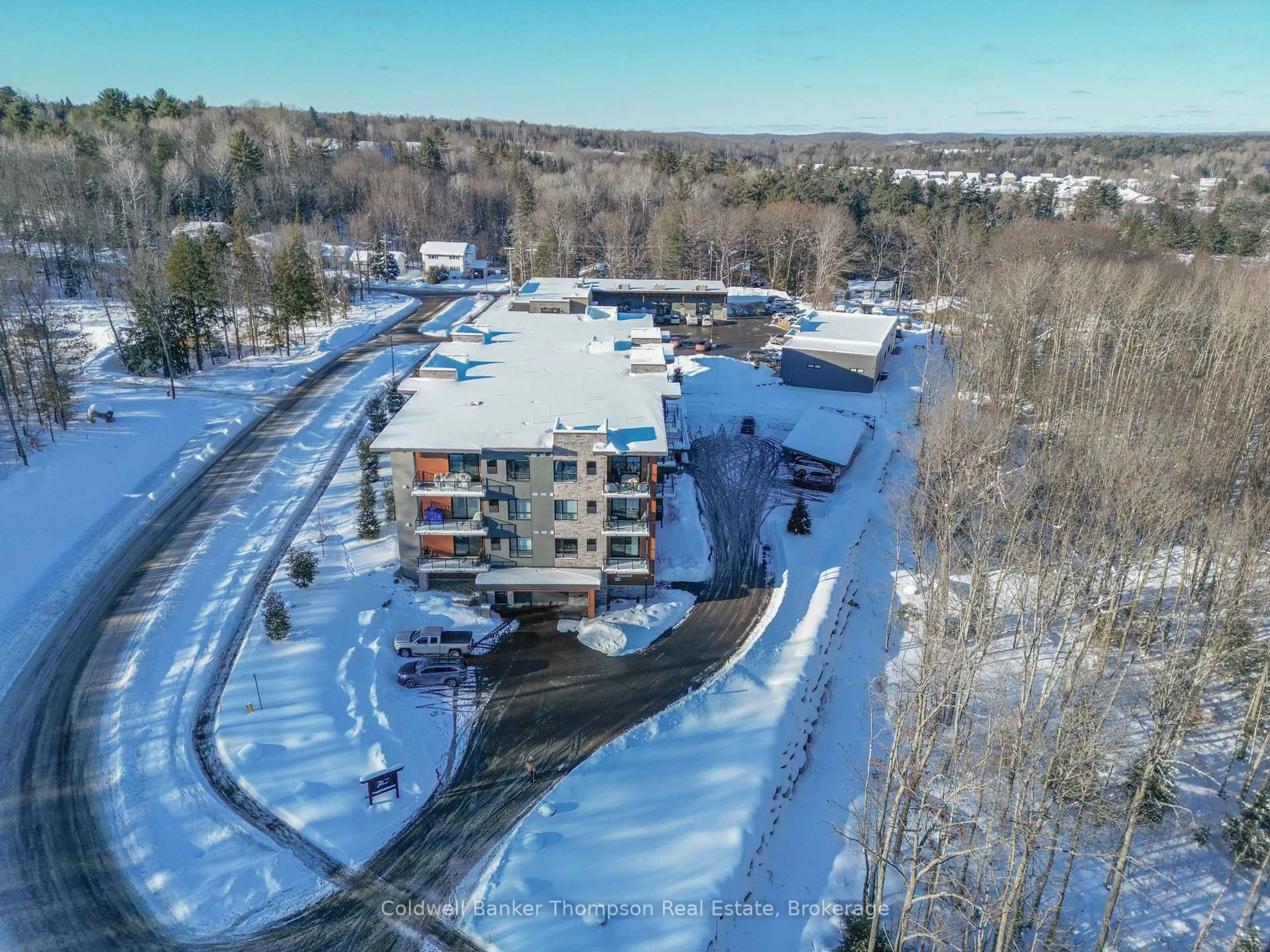 A pic from outside/outdoor area/front of a property/back of a property/a pic from drone, building for 23 Campus Tr #202, Huntsville Ontario P1H 0G1