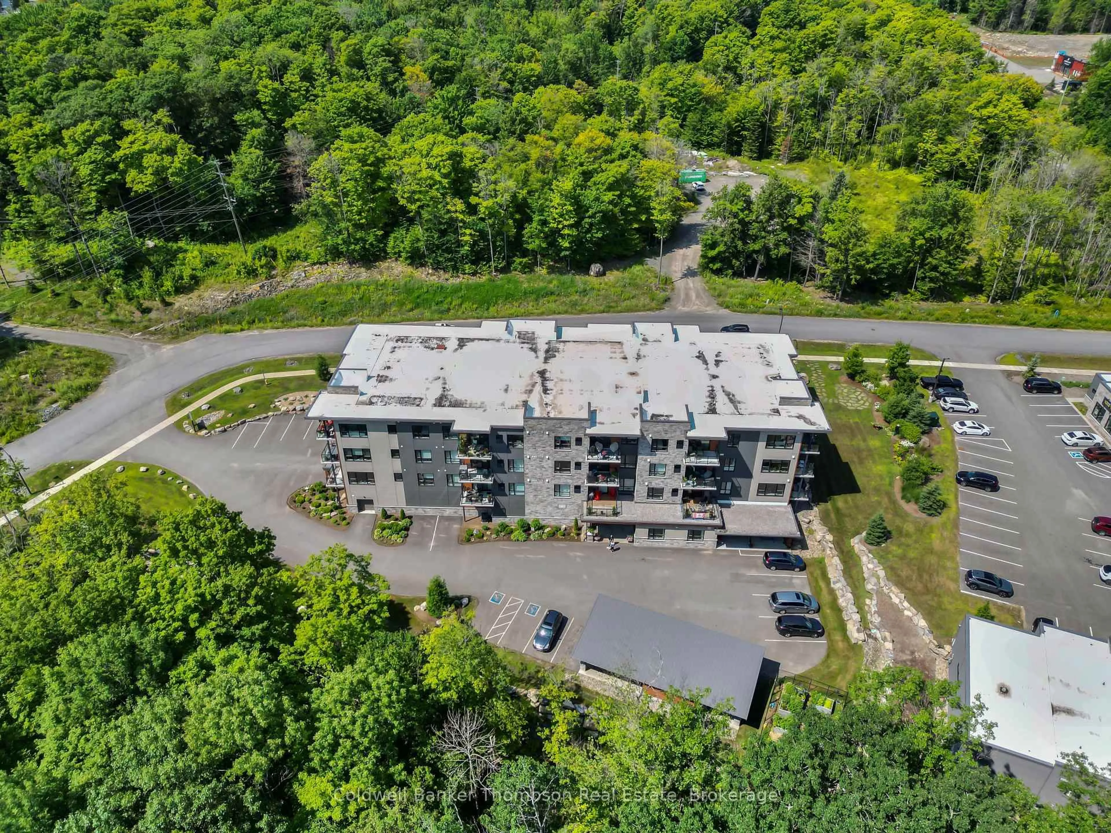 A pic from outside/outdoor area/front of a property/back of a property/a pic from drone, unknown for 23 Campus Tr #202, Huntsville Ontario P1H 0G1