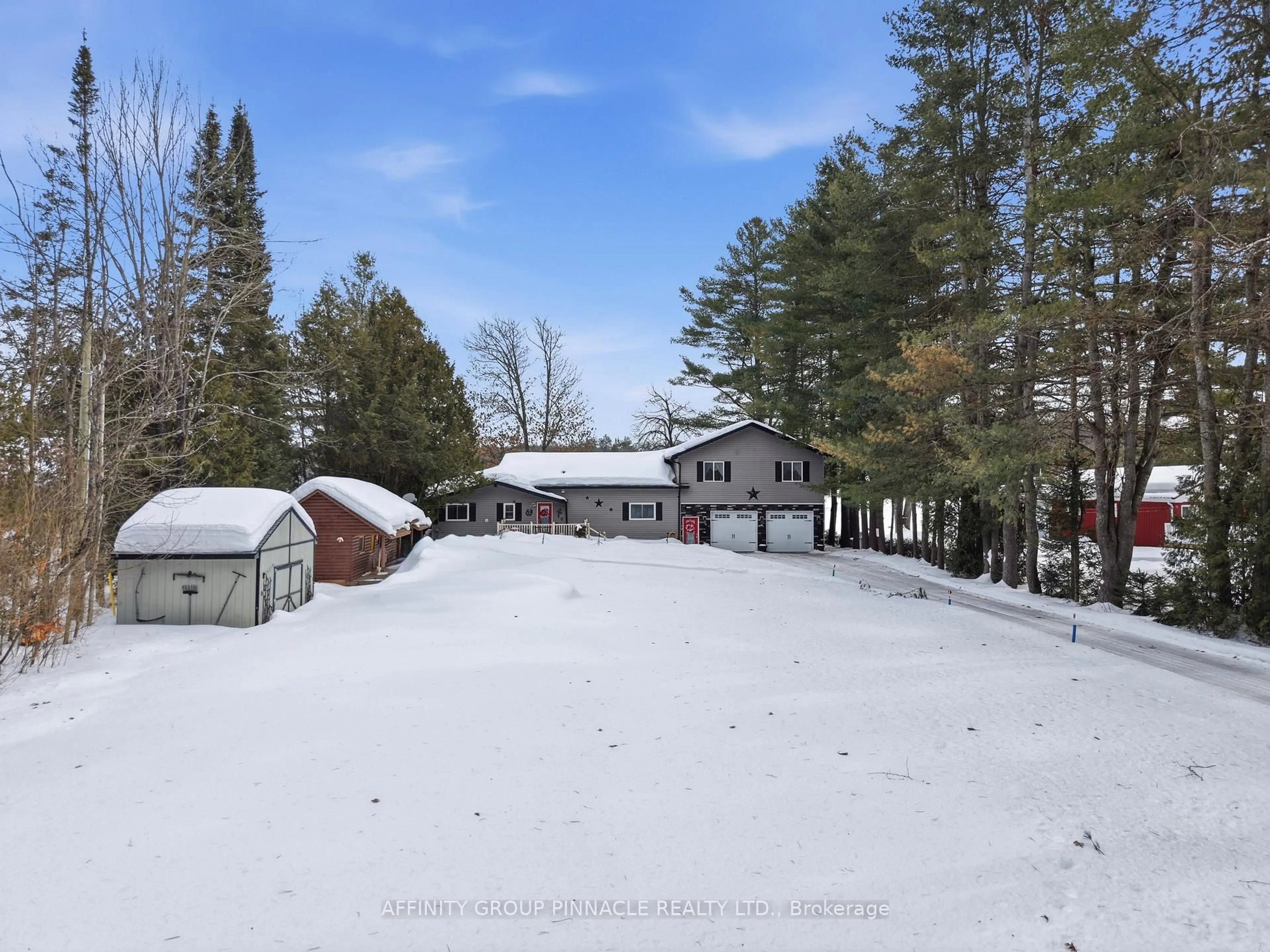 A pic from outside/outdoor area/front of a property/back of a property/a pic from drone, forest/trees view for 1150 Moore Lake Estates Rd, Minden Hills Ontario K0M 2L1