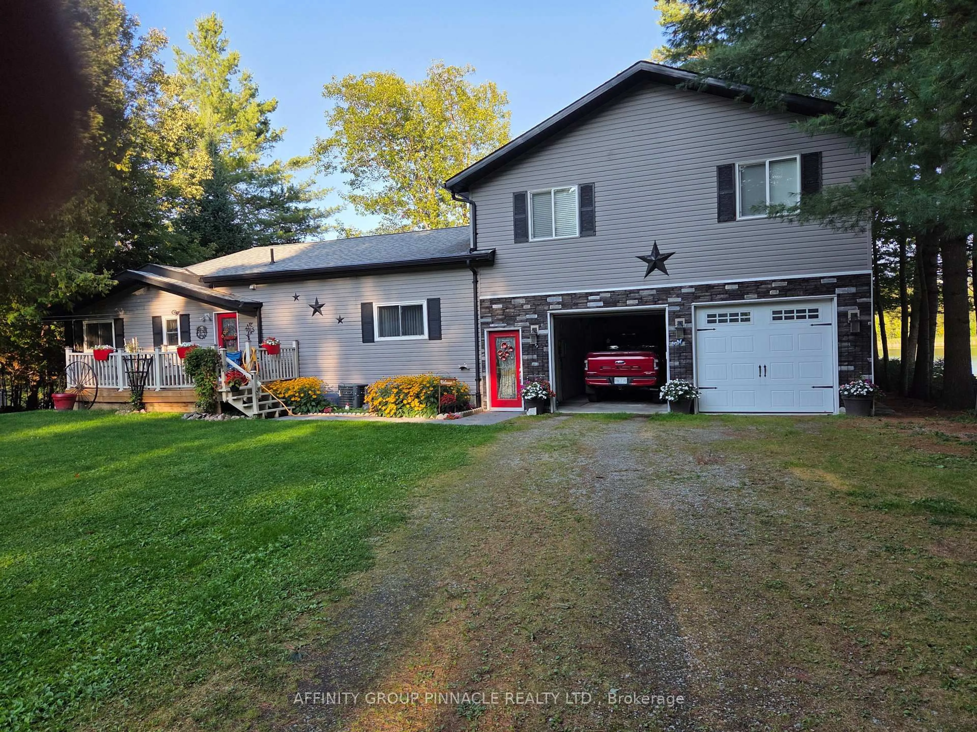 A pic from outside/outdoor area/front of a property/back of a property/a pic from drone, street for 1150 Moore Lake Estates Rd, Minden Hills Ontario K0M 2L1