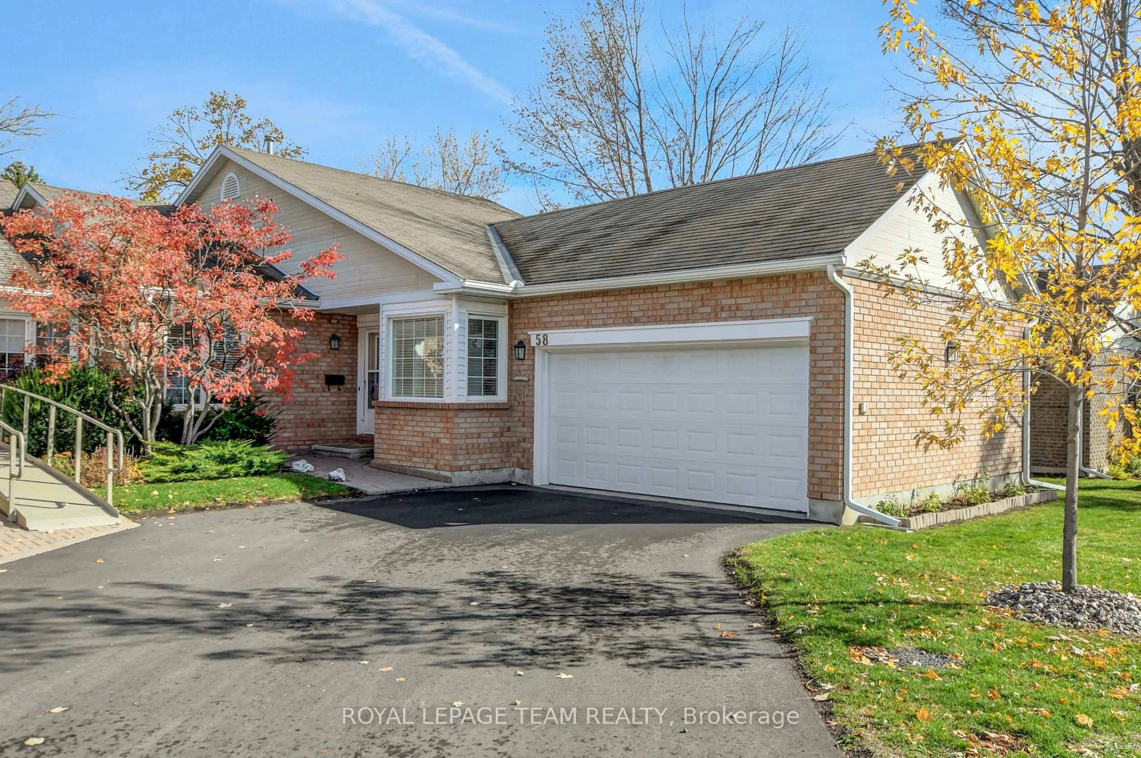 Home with brick exterior material, street for 58 Grand Harbour Crt, Stittsville Ontario K2S 1H1