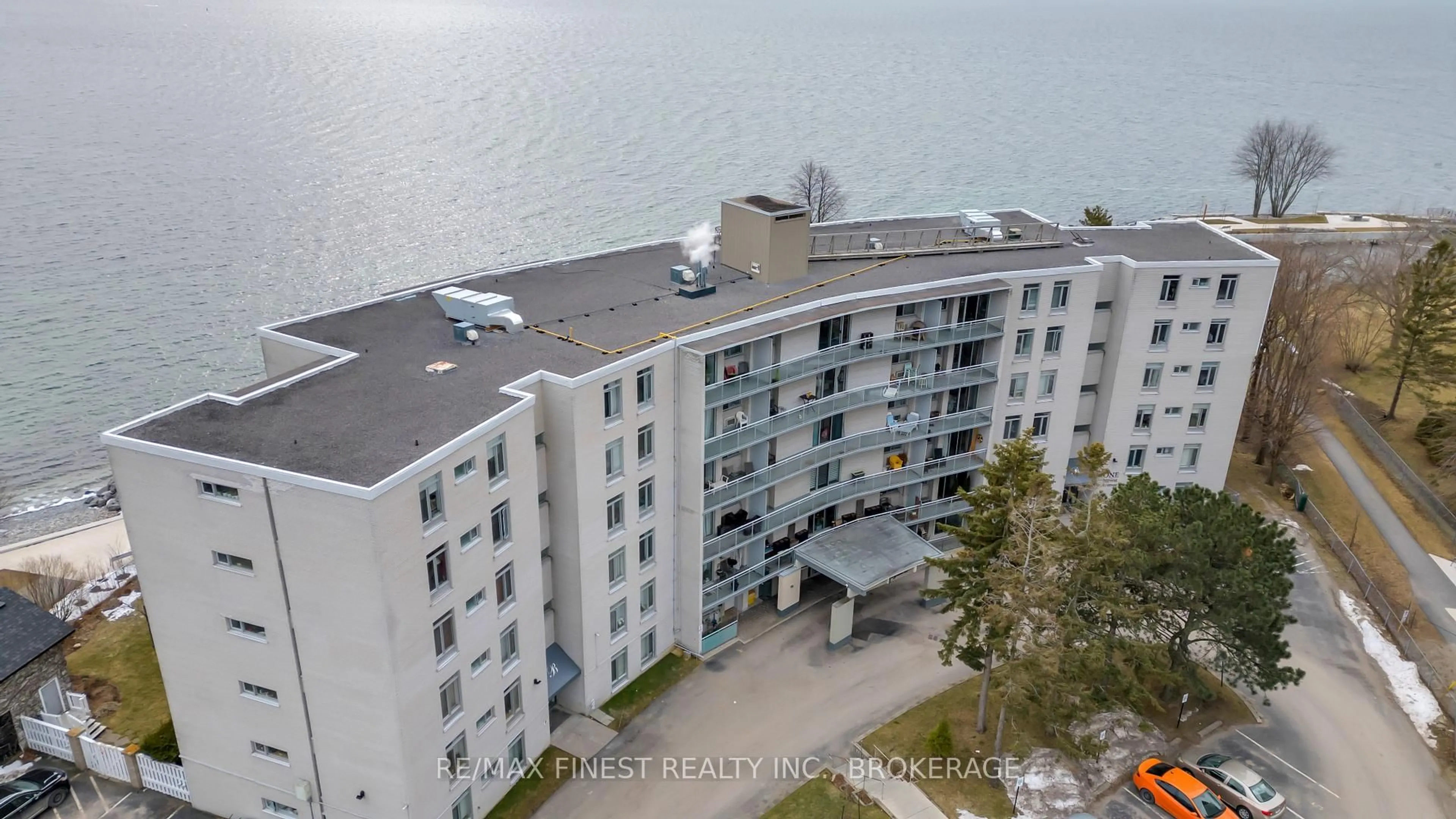 A pic from outside/outdoor area/front of a property/back of a property/a pic from drone, water/lake/river/ocean view for 1 Mowat Ave #106, Kingston Ontario K7M 1J8